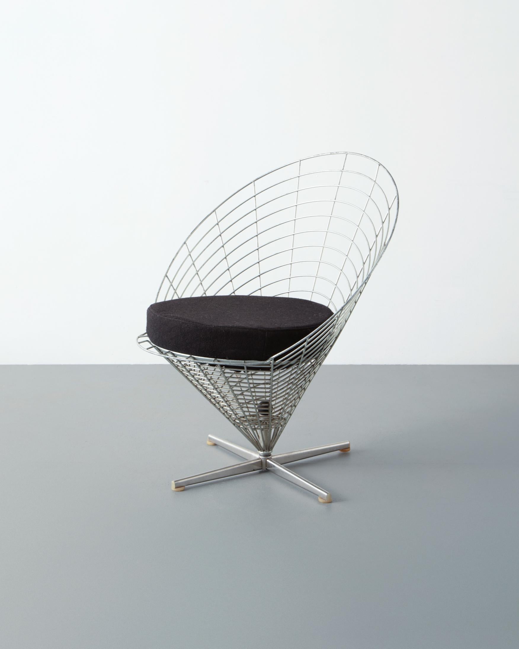 Verner Panton. Wire cone chair, model K2. Designed 1959. An early example manufactured by Plus-linje, Denmark. Galvanized and chrome-plated steel. Cushion: 21