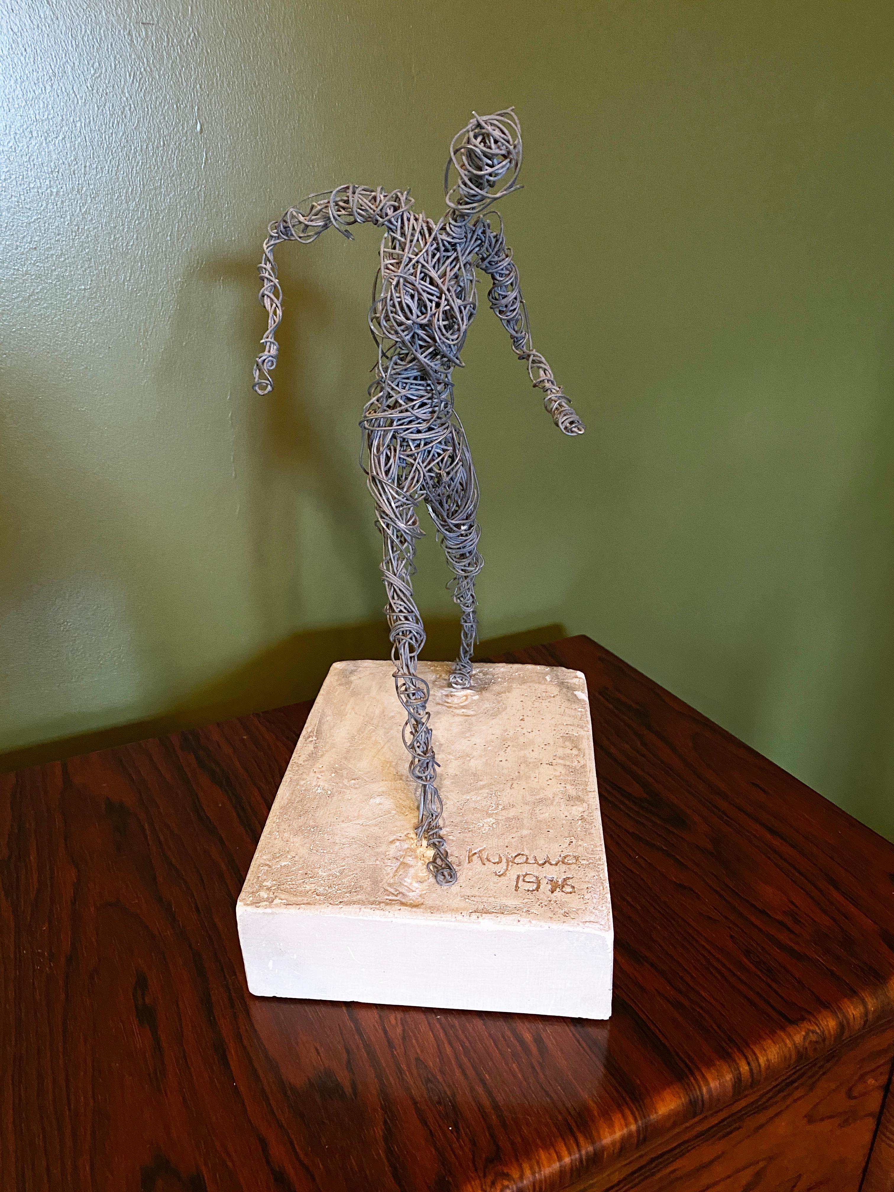 Female figure sculpted in wire on cast concrete base, signed Kujawa 1976. Kujawa was a student of the famed French sculptor Cesar Baldaccini. One of three unique figures available. The three together make a fantastic set.

Other two figures listed