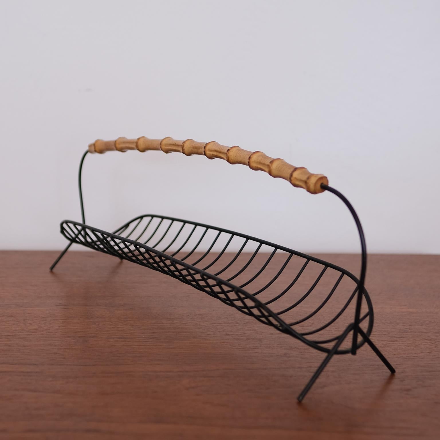 Wire fruit basket with cane handle. 1950s.