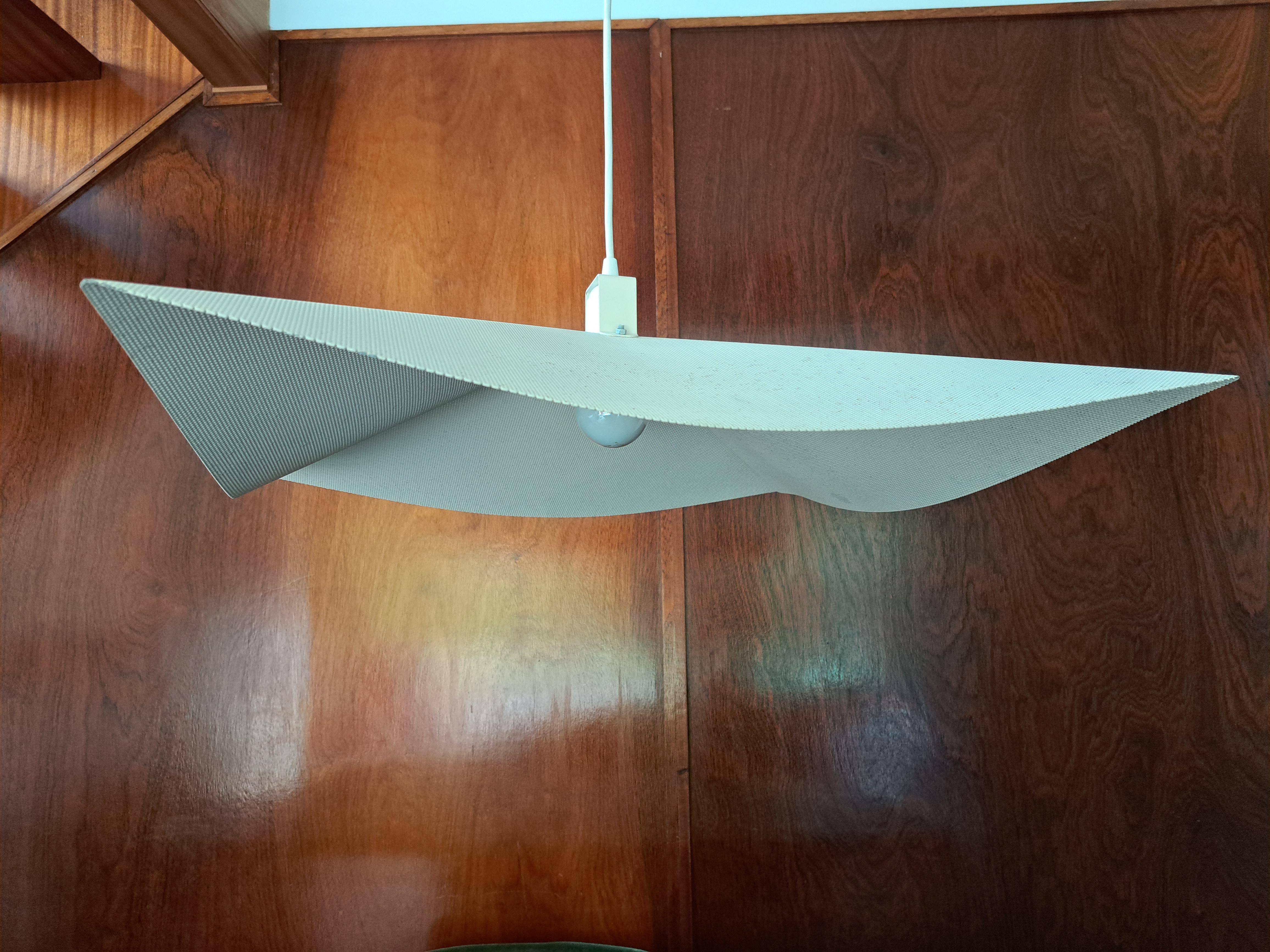 Postmodernism late 20th-century, elegant ceiling light made out of a continuous perforated metal. Creating a rather light floating shape. Original Cream colour, the colour looks like it might have been recoated at a later date. Overall condition,