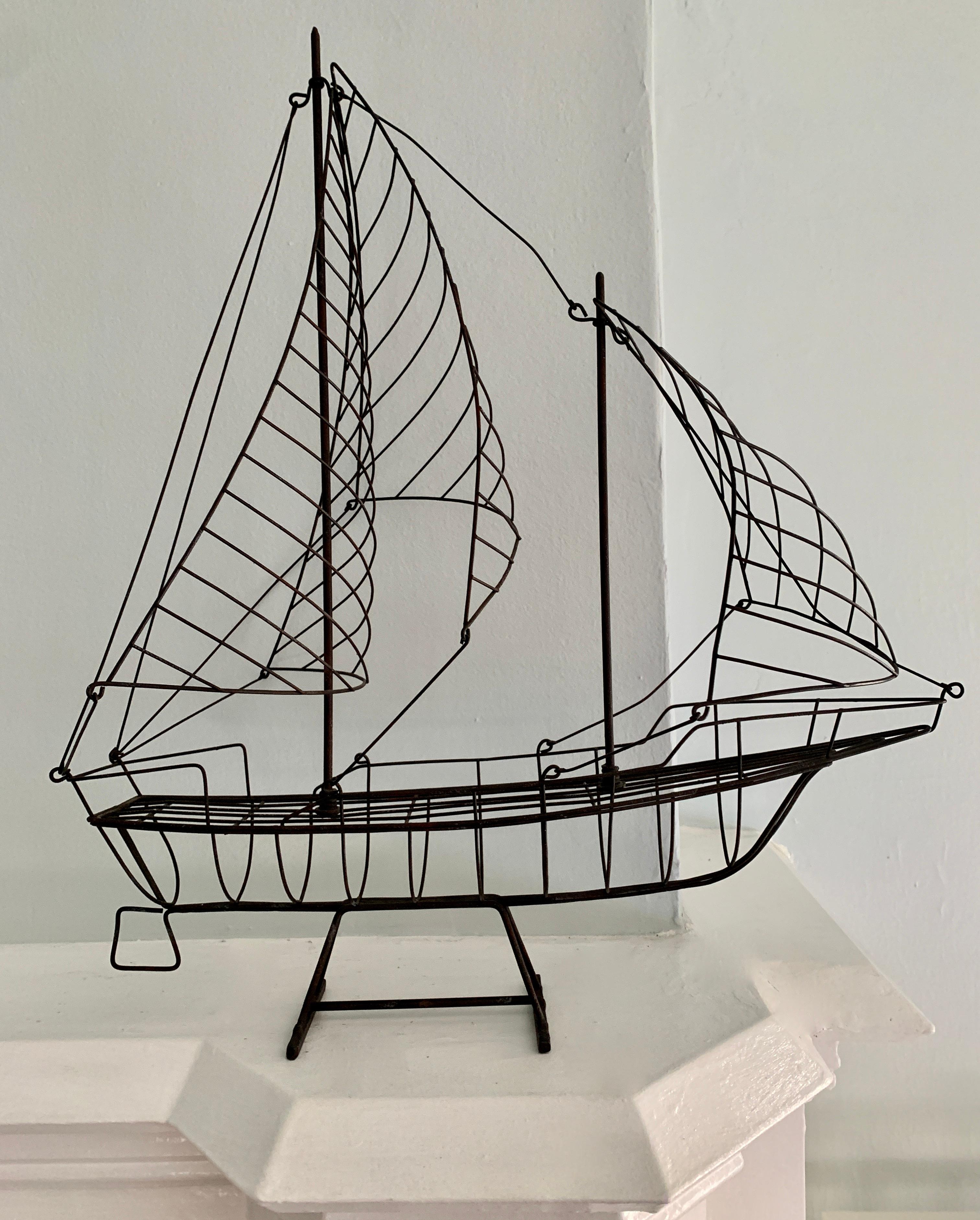 A wonderful sculpture of a ship with large blowing sales, this simple, yet effective sculpture would be perfect on any shelf, especially for the lover of the sea or seaside home.