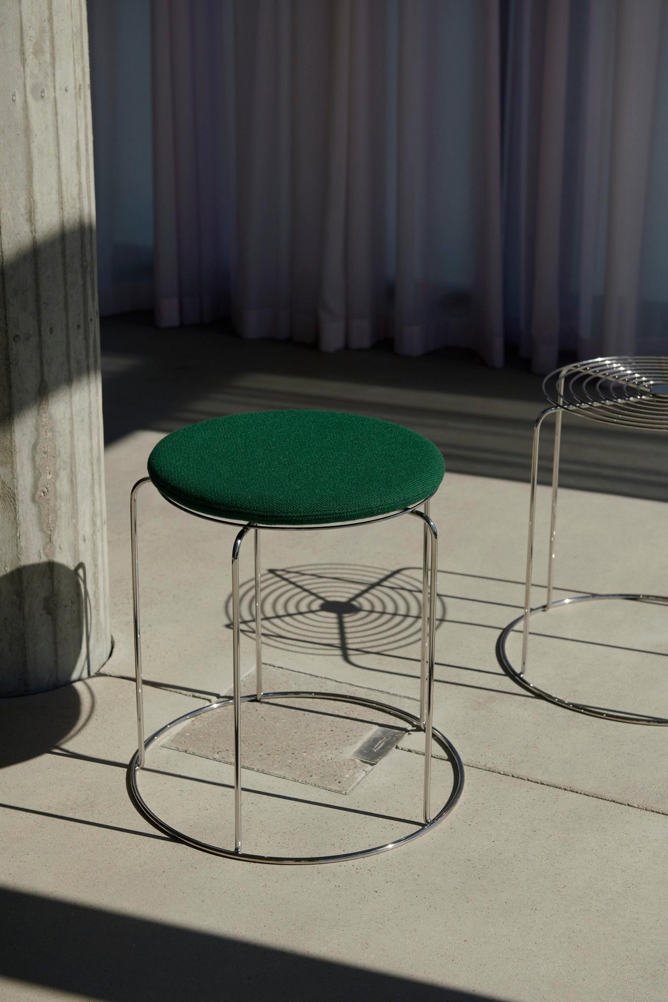 What makes the Wire Stool indicatively Verner Panton is the use of stainless-steel wire to create a simple geometric shape with repeated patterns, in a stackable stool that doubles as a side table. 
An icon from the archives destined to become a