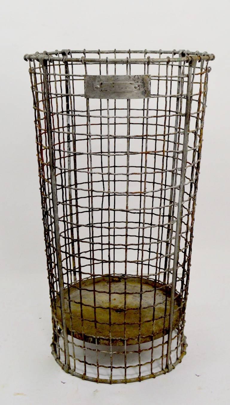 Nice vintage woven wire trash can by Norwich Wire Works.