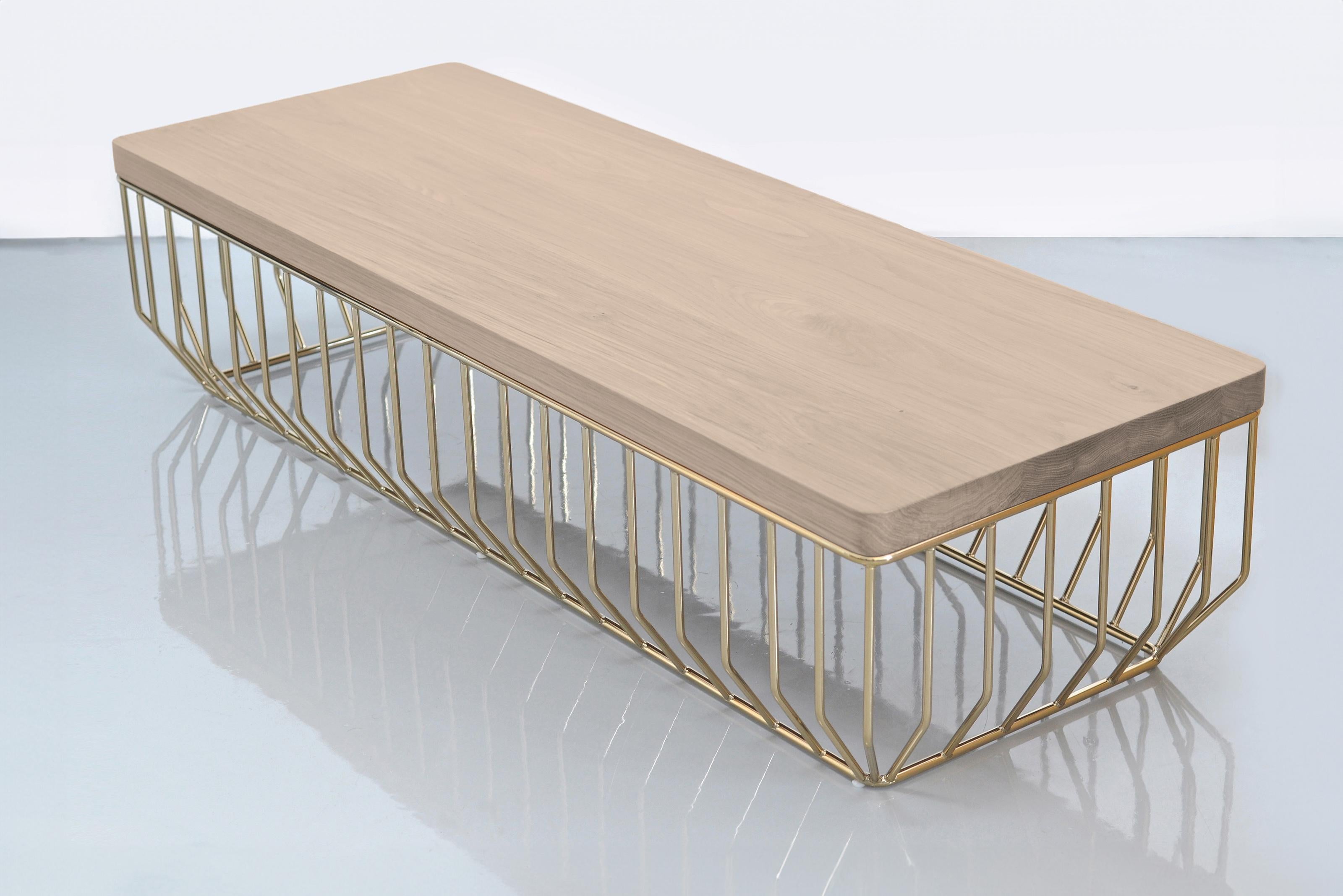 Wired Bench by Phase Design
Dimensions: D 152.4 x W 55.9 x H 34.9 cm. 
Materials: Smoked brass metal and white oak.

Solid steel bar with upholstered or solid wooden tops, available in walnut, white oak, or ebonized oak. Steel bar available in gloss