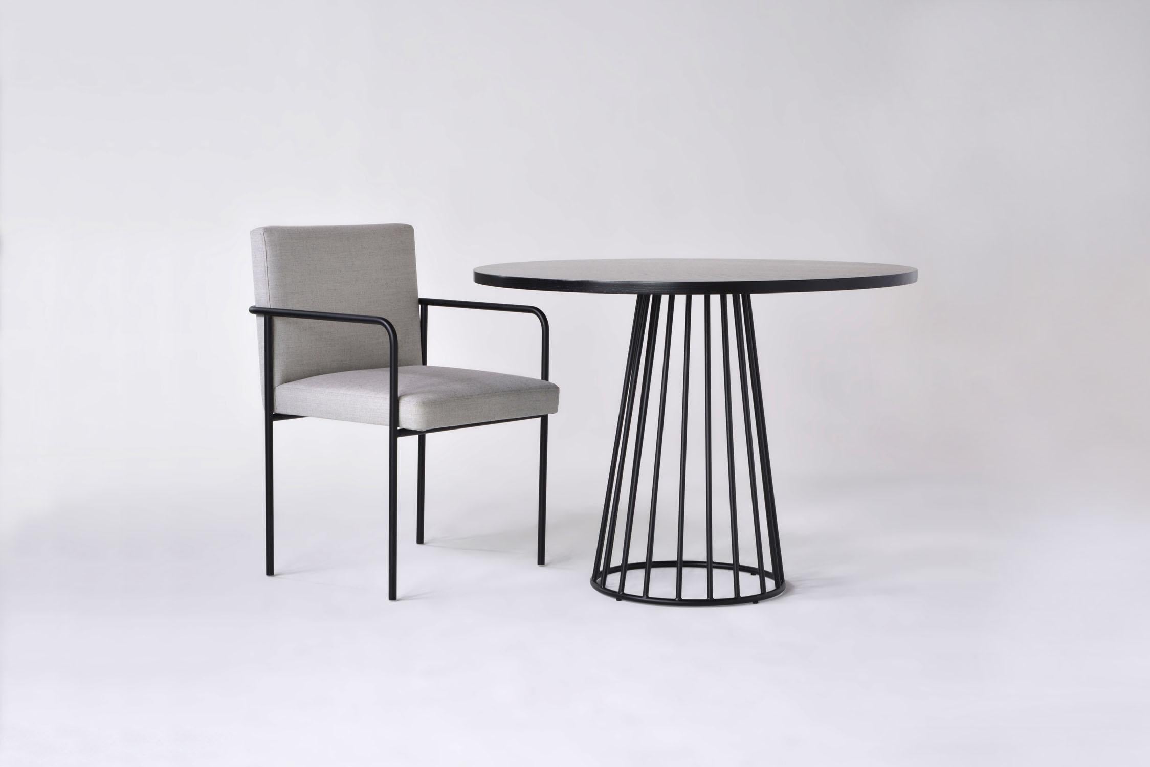 Listed price is for the Wired Cafe Table with a Flat Black or Flat White base in either walnut, white oak, or ebonized oak. 

Prices exclude packing.

Tapered lengths of metal meet with intention in a modern interpretation of the wiry idea