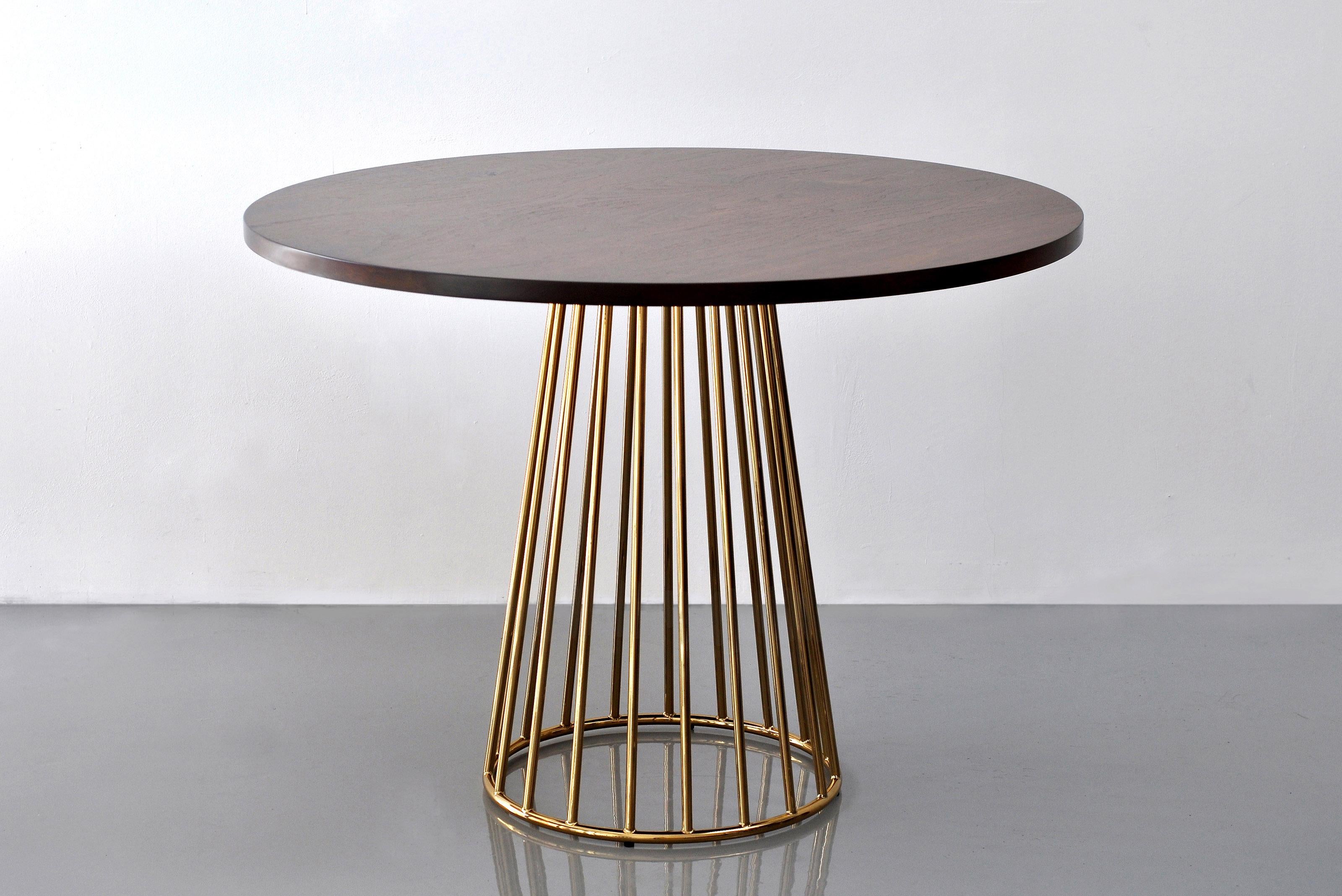 Wired Café Table by Phase Design
Dimensions: Ø 101.6 x H 73.7 cm. 
Materials: Smoked brass and walnut.

Solid steel bar with marble or solid wooden tops. Steel bar available in gloss or flat white and black powder coat, polished chrome, burnt