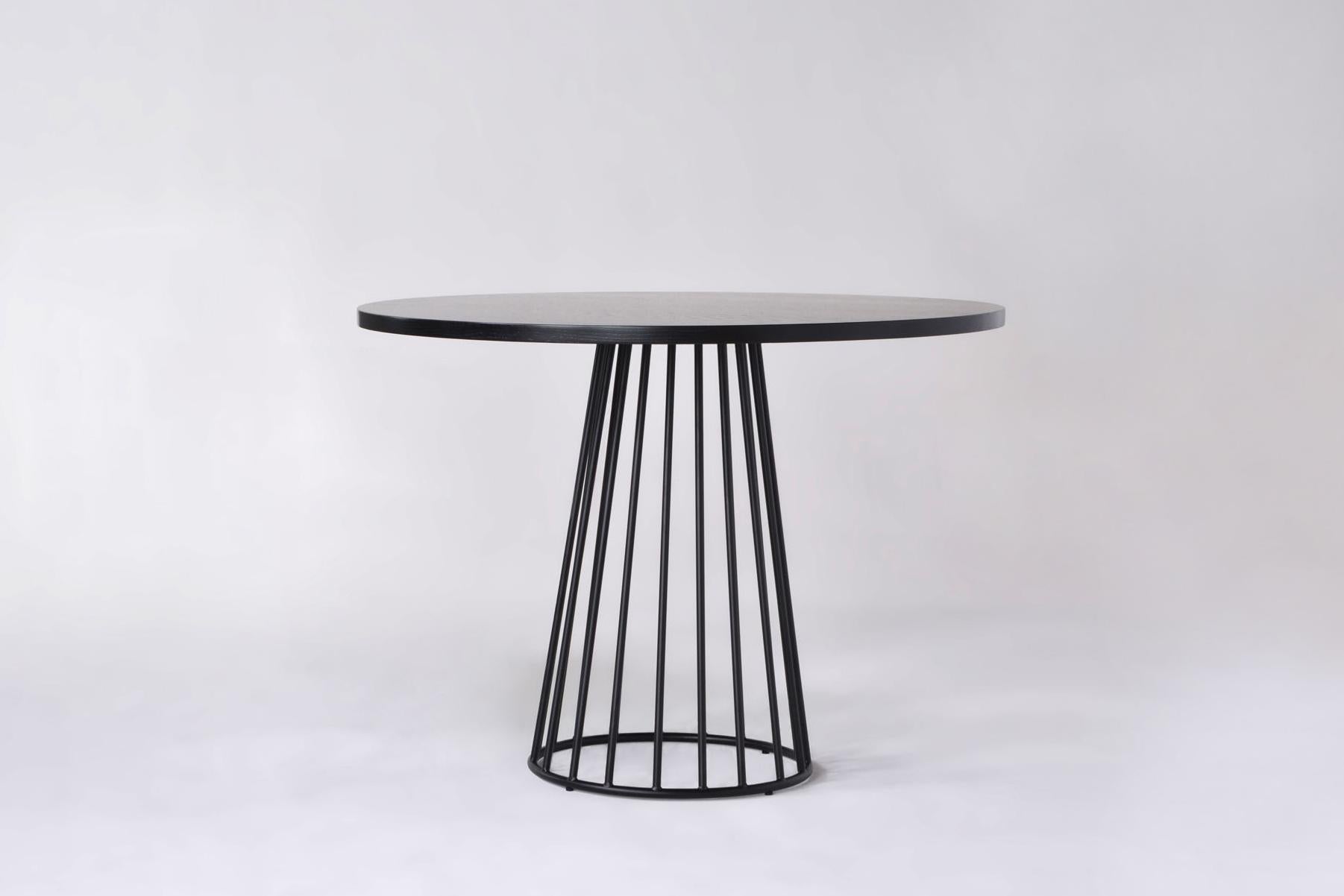 Listed price is for the wired cafe table with a polished chrome base and either walnut, white oak, or ebonized oak wood top. 

Prices exclude packing.

Tapered lengths of metal meet with intention in a modern interpretation of the wiry idea
