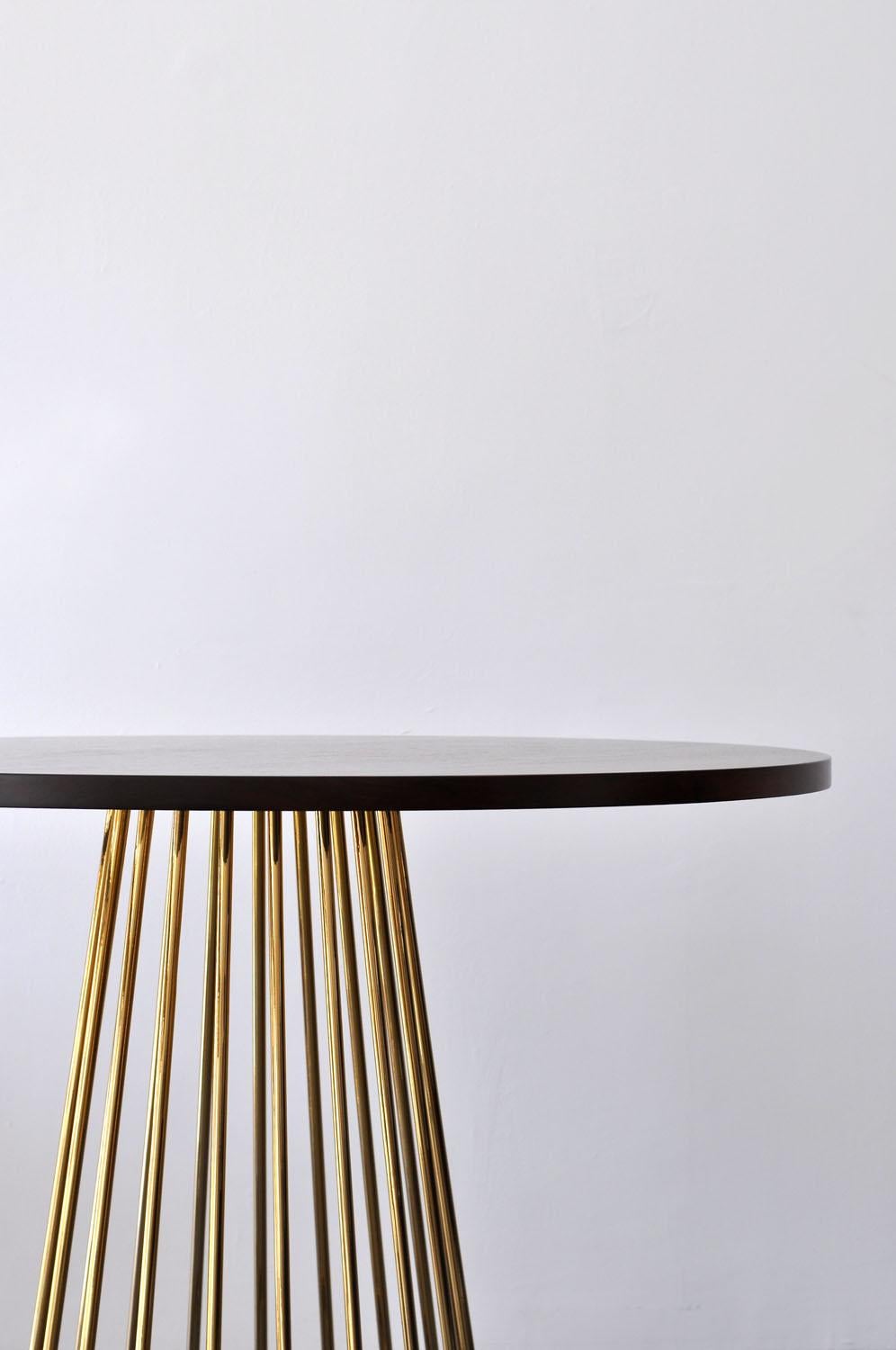 Listed price is for the wired cafe table with a smoked brass base and either walnut, white oak, or ebonized oak wood top. 

Prices exclude packing.

Tapered lengths of metal meet with intention in a modern interpretation of the wiry idea