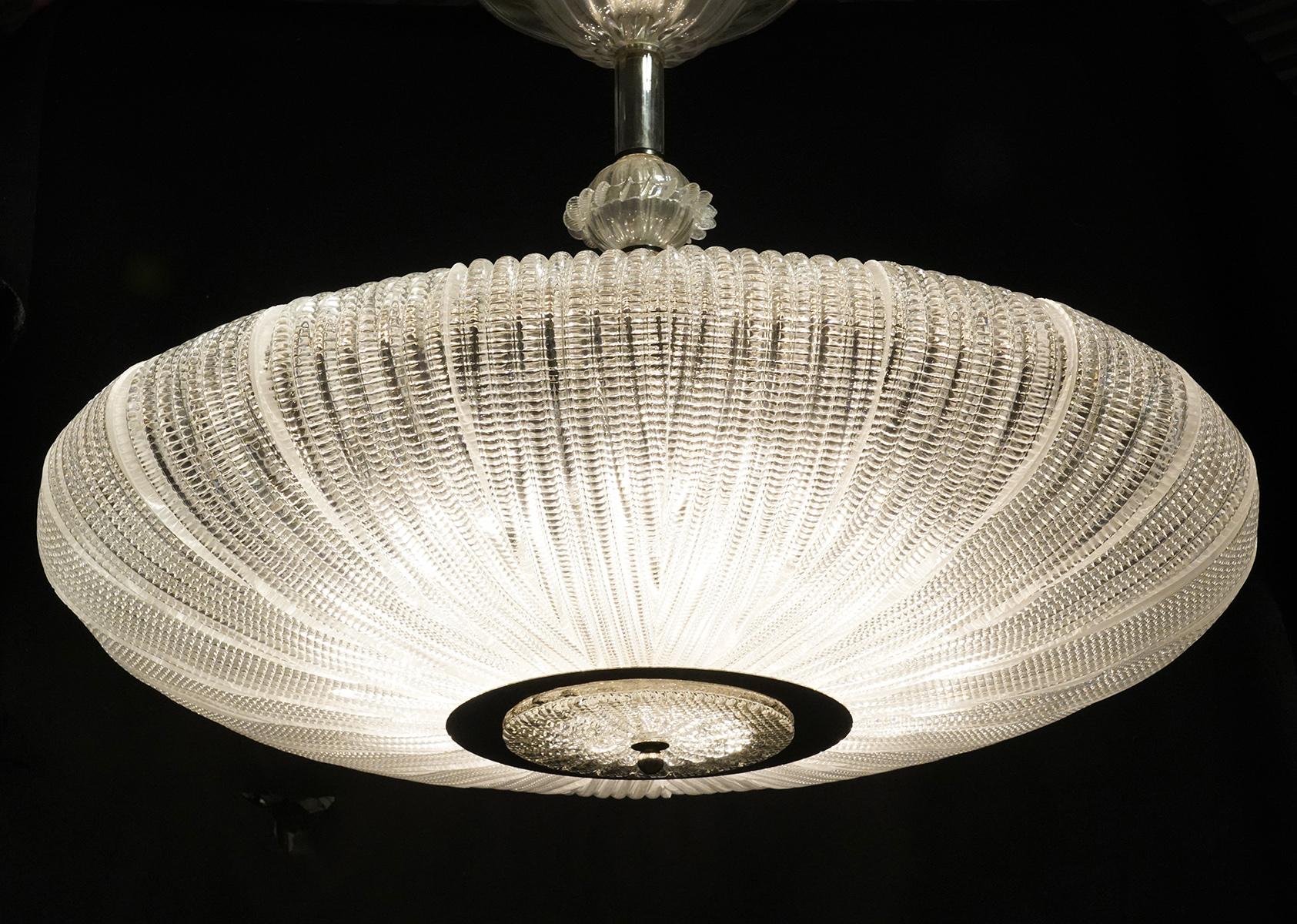 Wired custom lighting ceiling chandelier. According to their website: 'Montreal' is the model. Finish: Plated polished nickel and clear art Hermes Glass. Lamp: (15) MED Base 40 Watts + (3) CA Base 40 Watts.