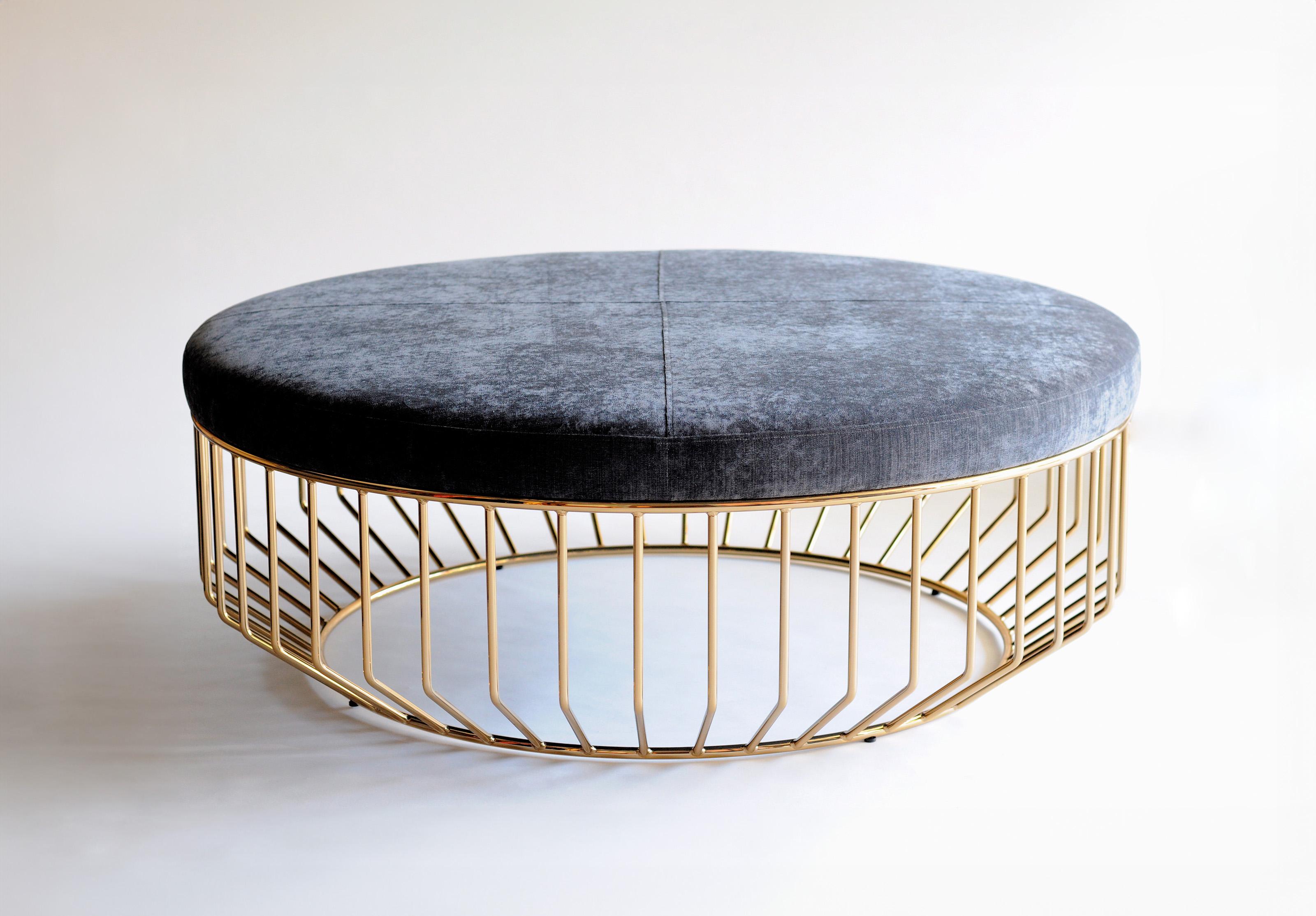 Wired Large Ottoman by Phase Design
Dimensions: Ø 106.7 x H 35.6 cm. 
Materials: Smoked brass and upholstery.

Solid steel bar with upholstered tops. Steel available in gloss or flat black and white, polished chrome, burnt copper, or smoked brass