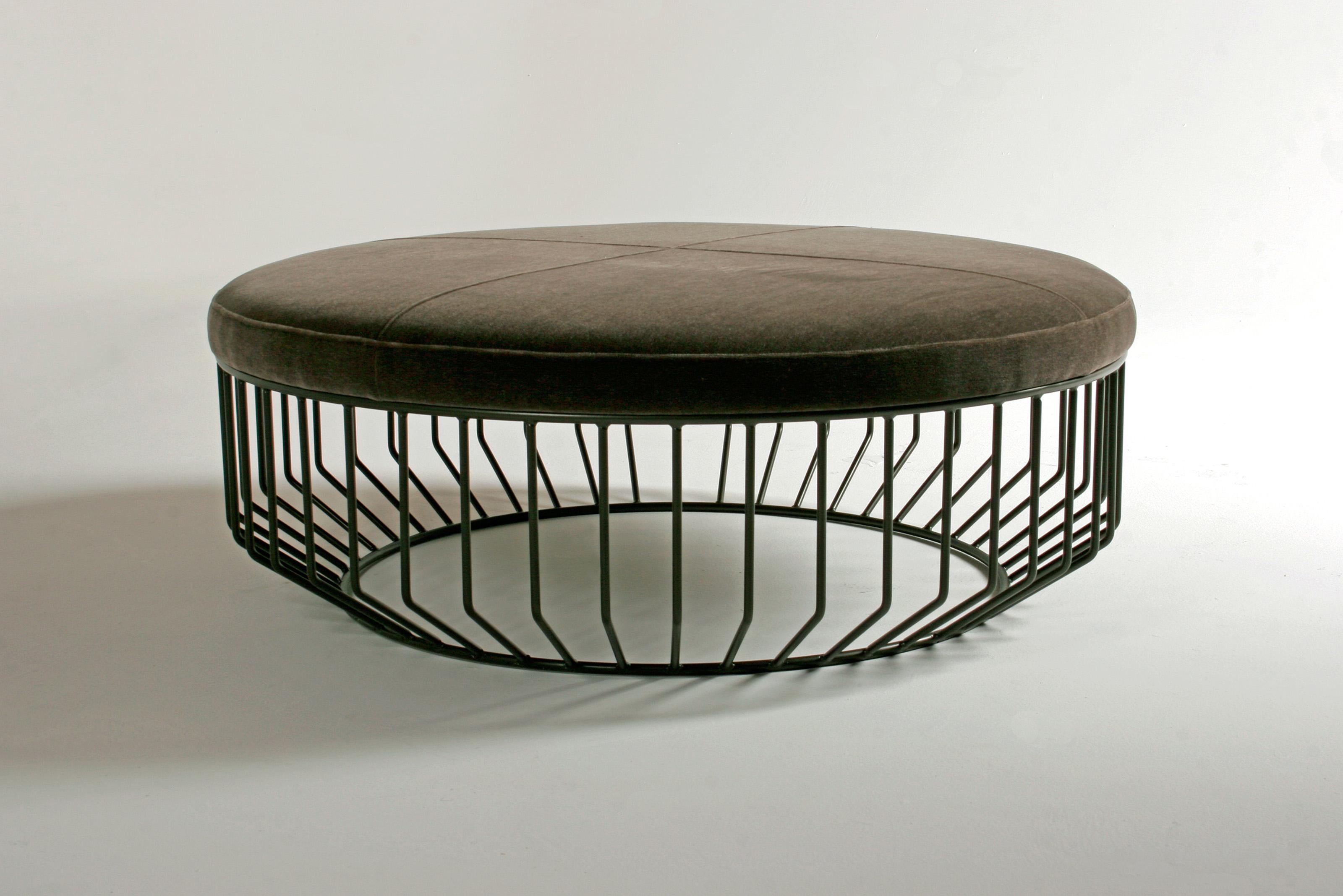 Wired Large Ottoman by Phase Design
Dimensions: Ø 106.7 x H 35.6 cm. 
Materials: Powder-coated metal and upholstery.

Solid steel bar with upholstered tops. Steel available in gloss or flat black and white, polished chrome, burnt copper, or smoked