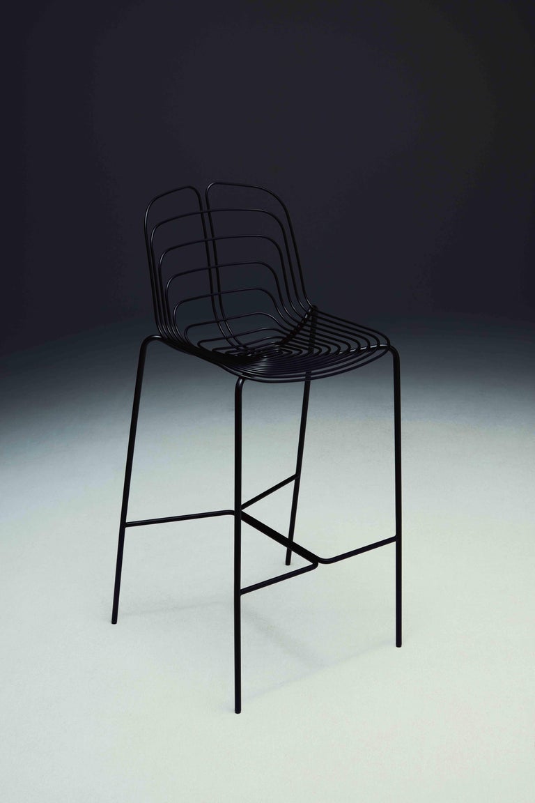 Wired stool by Michael Young
Dimensions: W 50 x D 51.7x H 107 cm
Materials: Powder Coated Metal structure

The Wired Chair by Michael Young is a proud tribute to Harry Bertoia’s iconic design. This updated take on a classic piece is crafted from