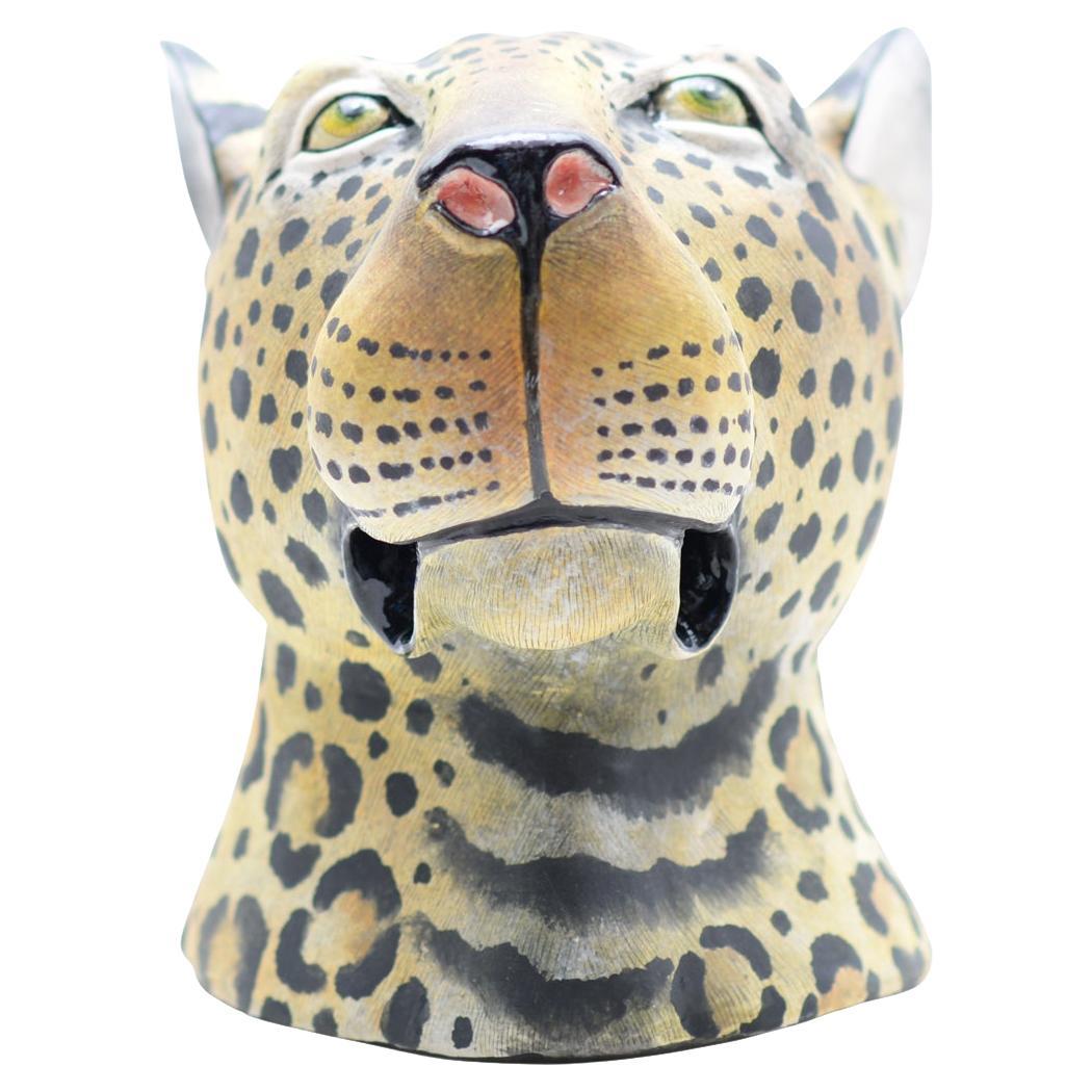 Introducing the Wiseman Ceramics Leopard Bust, a stunning piece hand-sculpted by Thabo Mbhele and painted by Wiseman Ndlovu. From the revered Big Five Collection emerges a captivating hand-sculpted bust, showcasing the untamed spirit of the leopard.