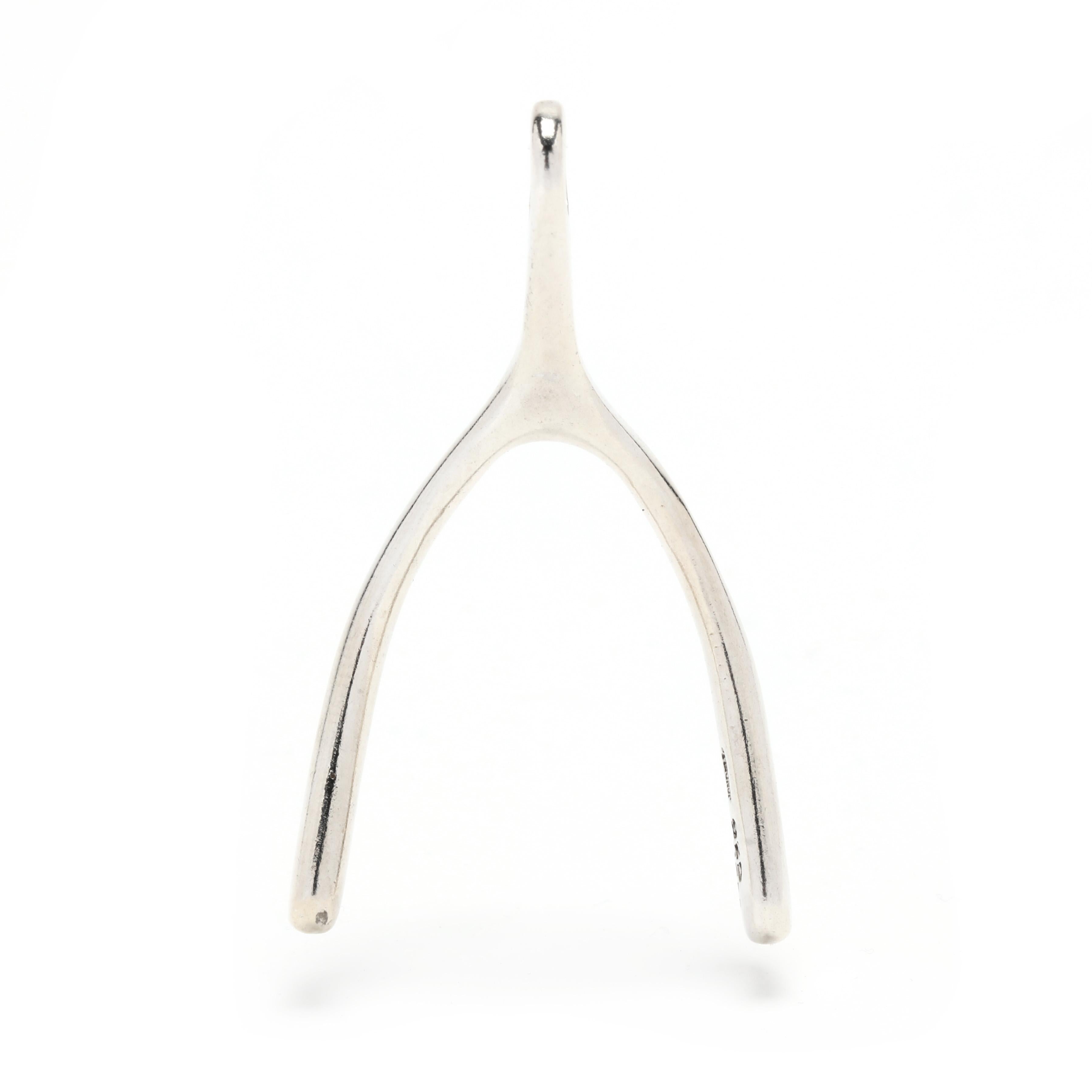 This exquisite Wish Bone pendant is the perfect addition to your jewelry collection. Crafted from sterling silver, the pendant measures 1 7/8 inches in length and features a delicate wish bone design. Handmade in Mexico, this piece of jewelry is