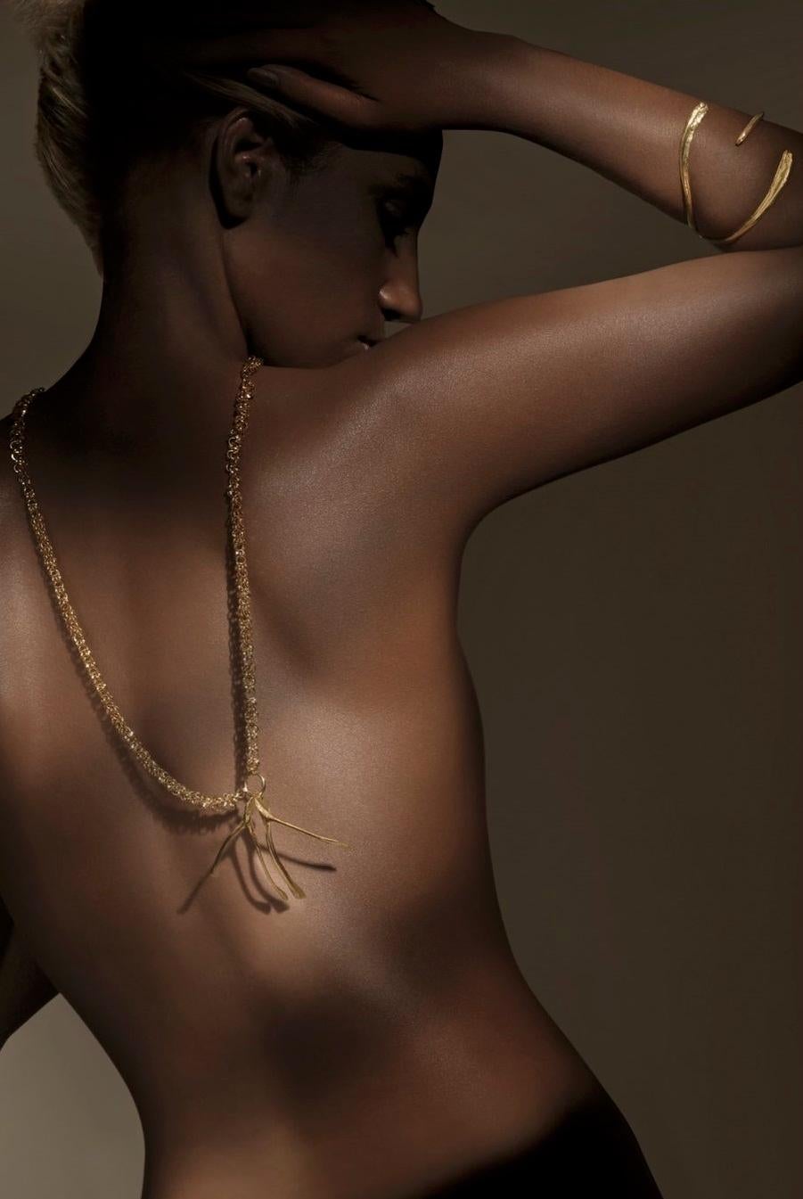 Designed by Alexandra Koumba this wishbone pendant is casted from the original chicken bone and embellished with a lavish chain to be a timeless accessory.

Two bones in one chain is symbolic of feng shui's ideal to pair things to attract