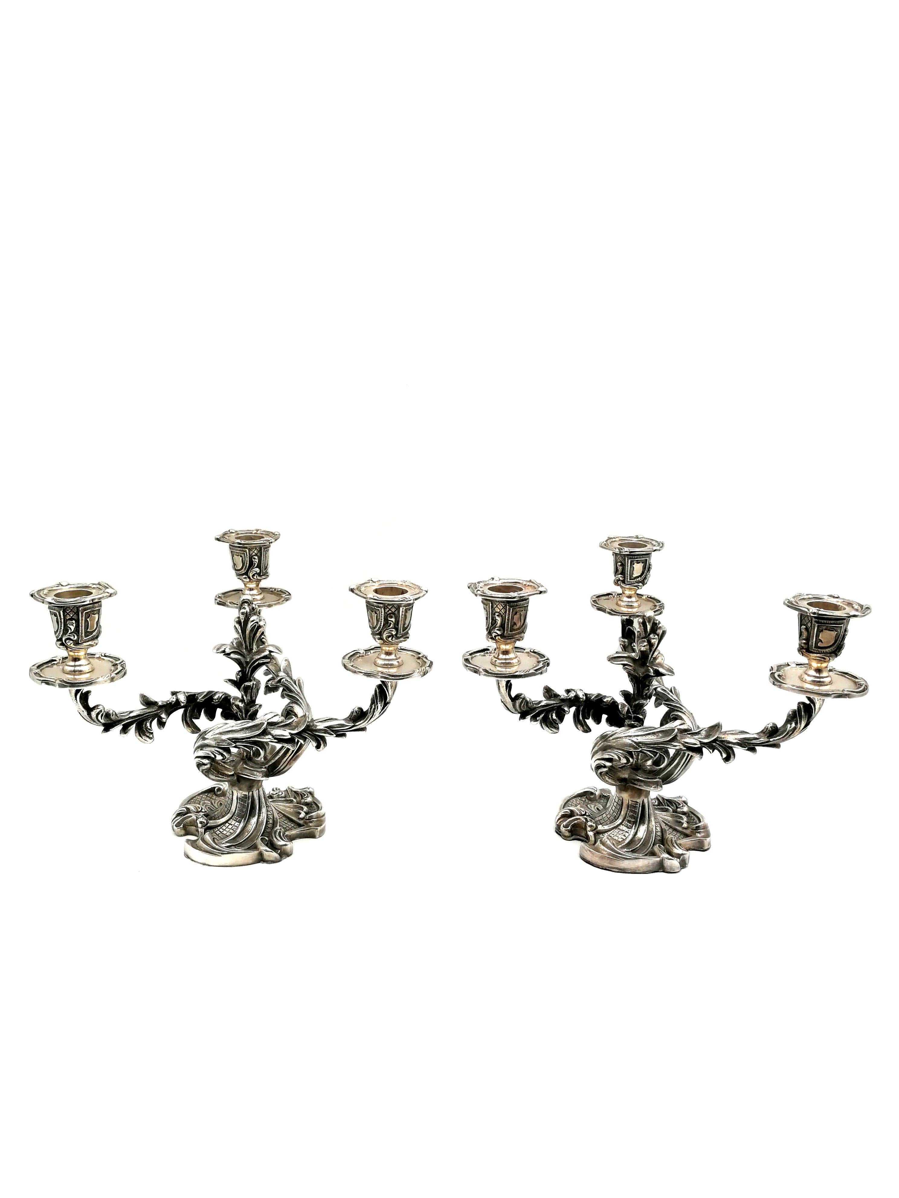 A stunning rare Belgian pair of silver plated candelabra in the louis XV style. Stamped with the manufacturers’ hallmark “Wiskemann”, the Swiss Cross and the Arabic numeral “20” along and an etched series of numbers. This is a cast of pure silver