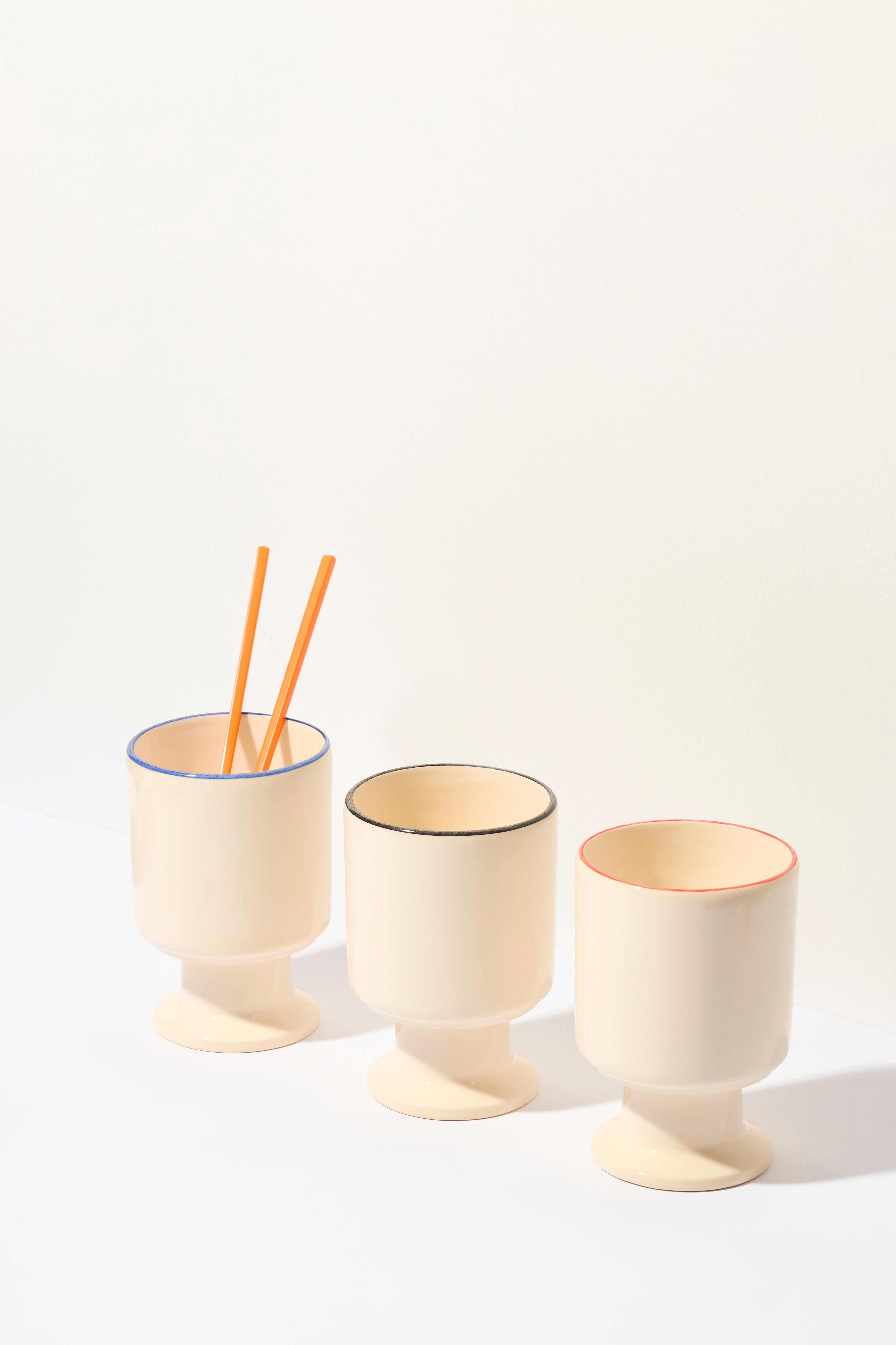 The WIT cup is a multifunctional vessel with a playful stem. It can become your favorite coffee cup, a dessert bowl, a container for pens, or other favorite accessories. WIT chalices can be stacked to create stable towers, making storage easy.

Dia.