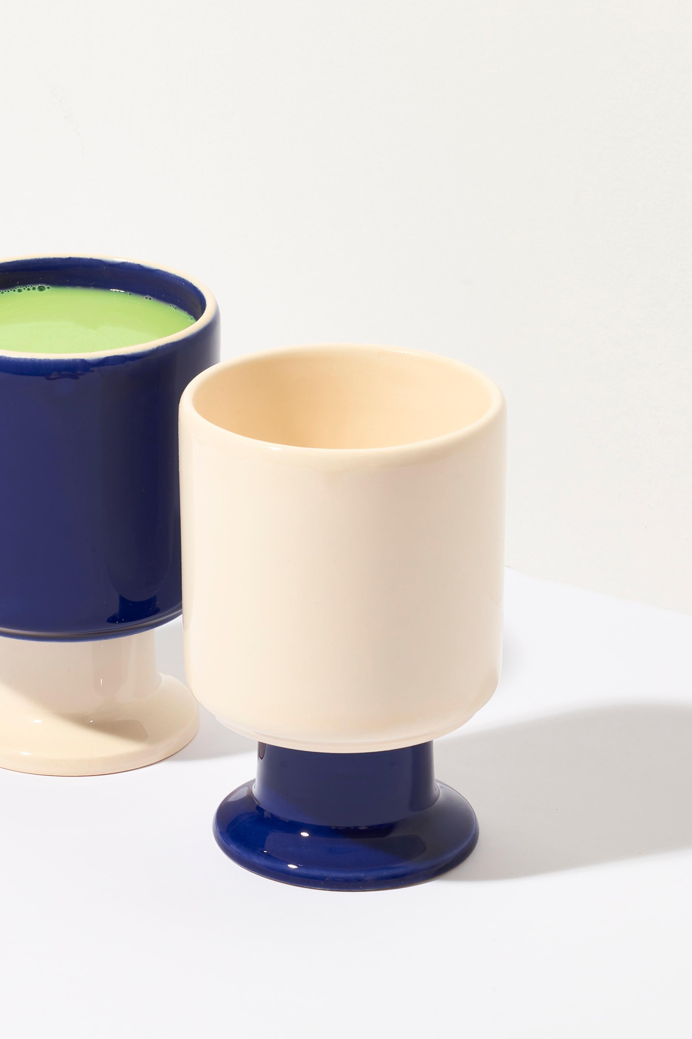 WIT mug / set of 2.

The WIT cup is a multifunctional vessel with a playful stem. It can become your favorite coffee cup, a dessert bowl, a container for pens, or other favorite accessories. WIT chalices can be stacked to create stable towers,