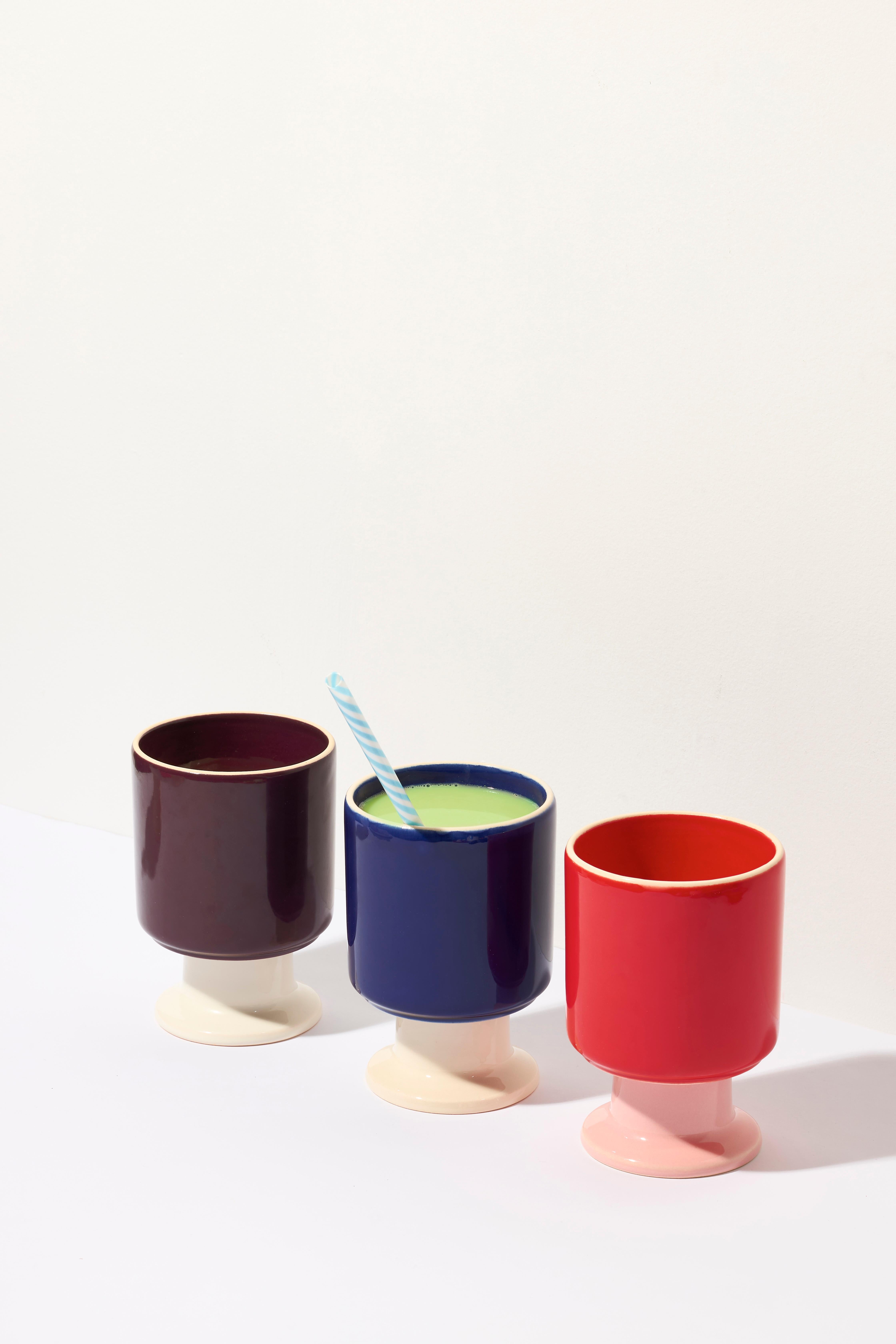 WIT mug / set of 3:
WIT / Kobalt
WIT / Red
WIT / Plum

The WIT cup is a multifunctional vessel with a playful stem. It can become your favorite coffee cup, a dessert bowl, a container for pens, or other favorite accessories. WIT chalices can be