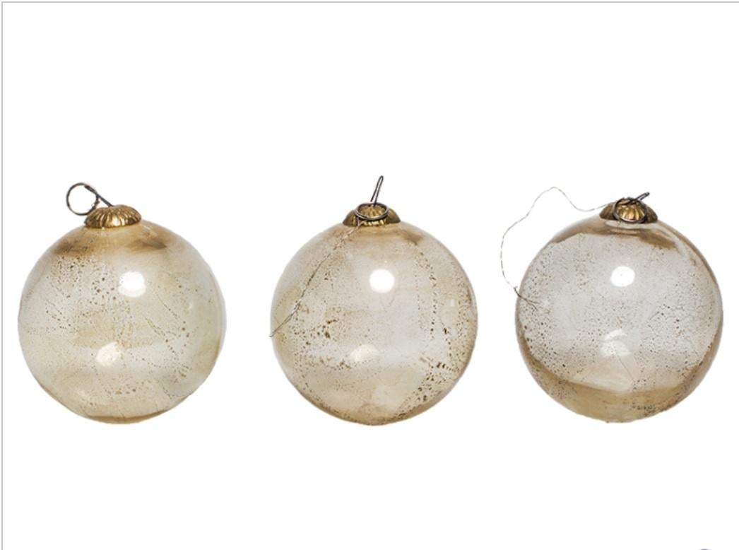 Italian blown glass witches balls slight golding, circa 1920s. Three available. Sold separately.