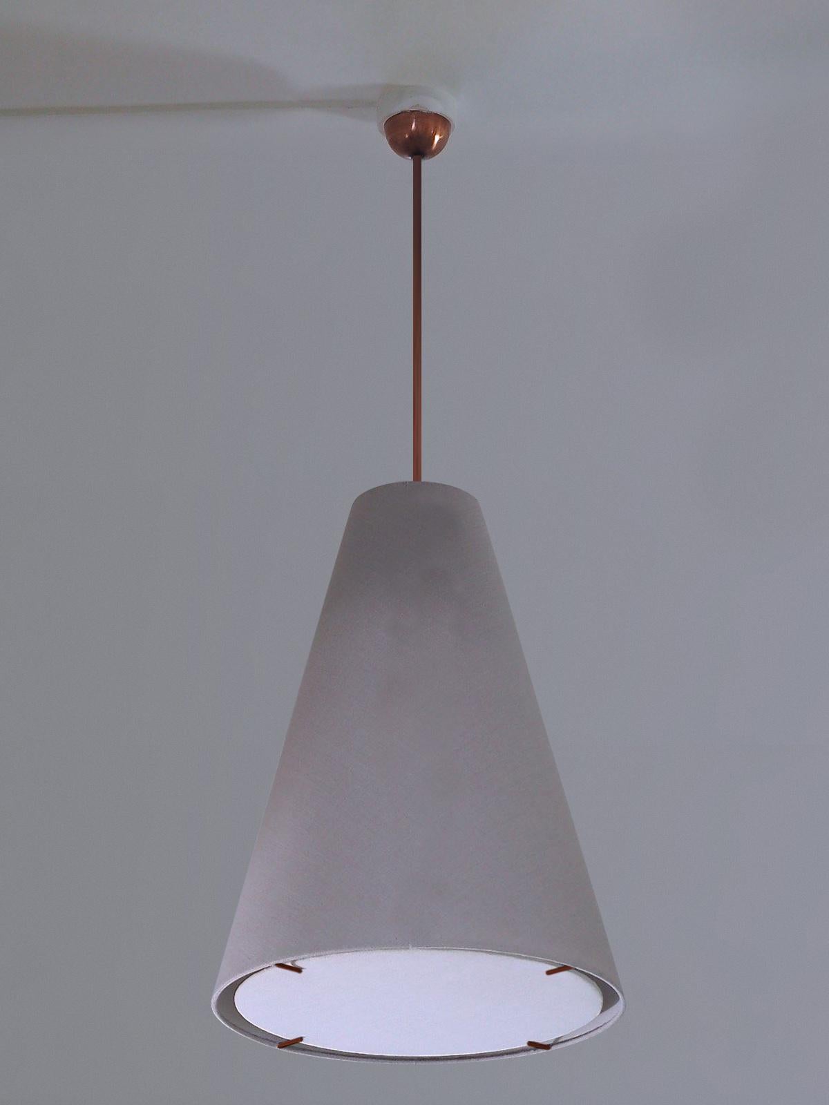 Witches Hat Pendant is a minimal uncluttered, selectively detailed, timeless, conical pendant that works equally well flush mounted or suspended. These hand made Wende Reid Studio lights include custom patinated solid brass stems and ceiling