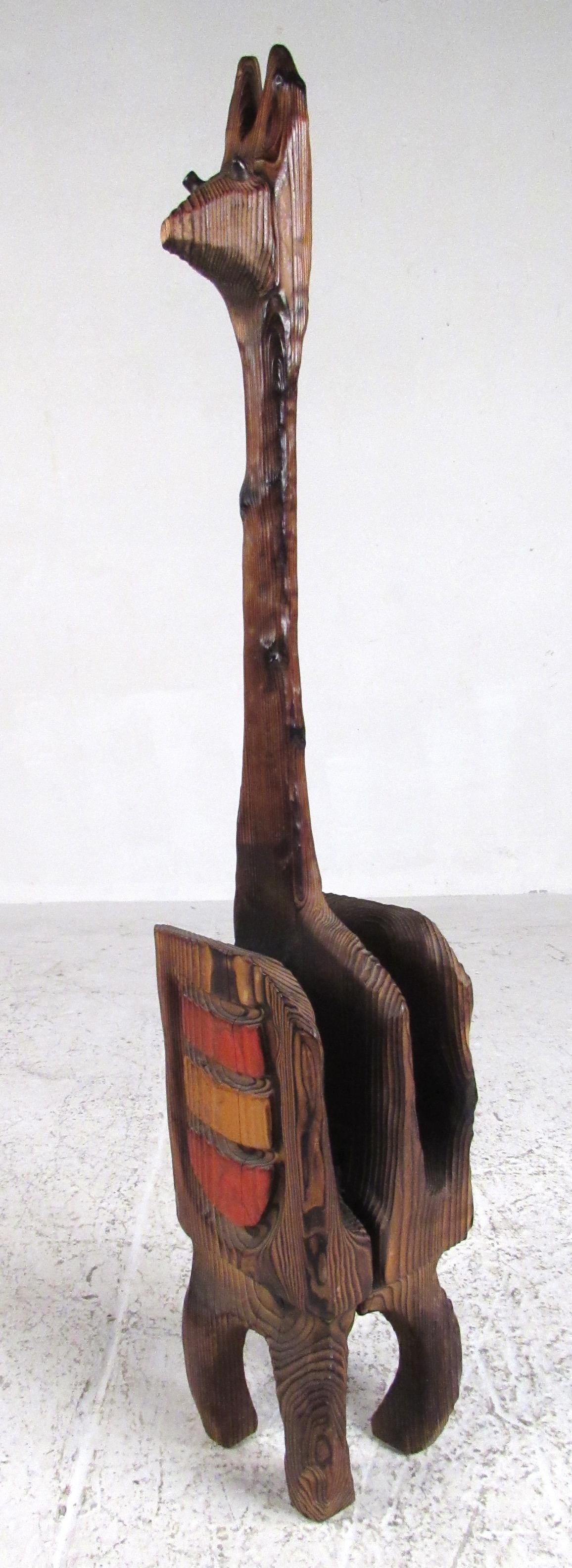 Magazine stand in carved wood designed by William Westenhaver and made famous when featured in The Jungle Room at Elvis' Graceland. Please confirm item location (NY or NJ) with dealer.
