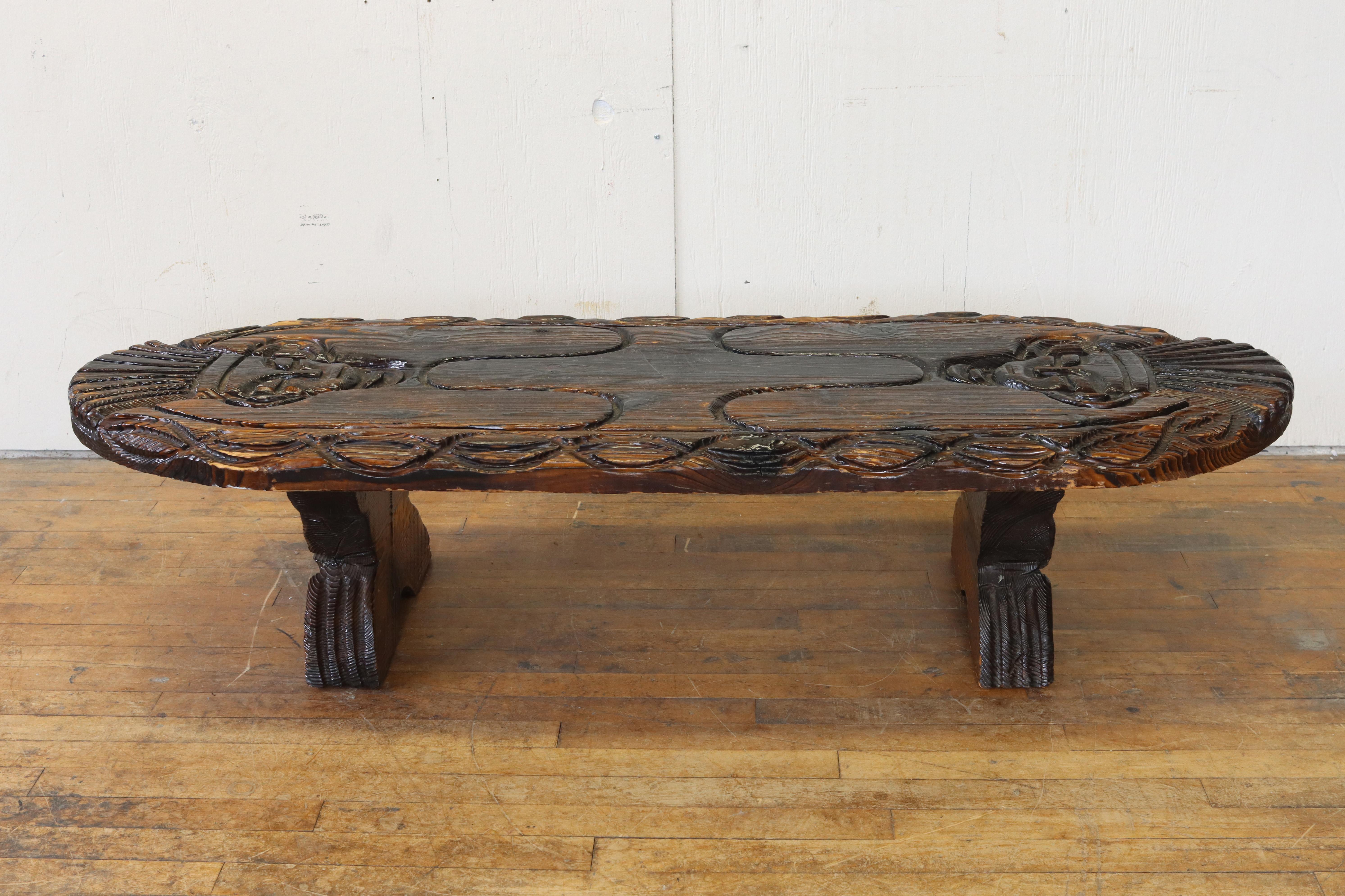 A hand-carved 1950s coffee table by William Westenhaver for his company Witco. Witco was founded in the pacific northwest and its handmade tiki pieces became instant hits on the west coast and across the country. Westenhaver's descendants still make