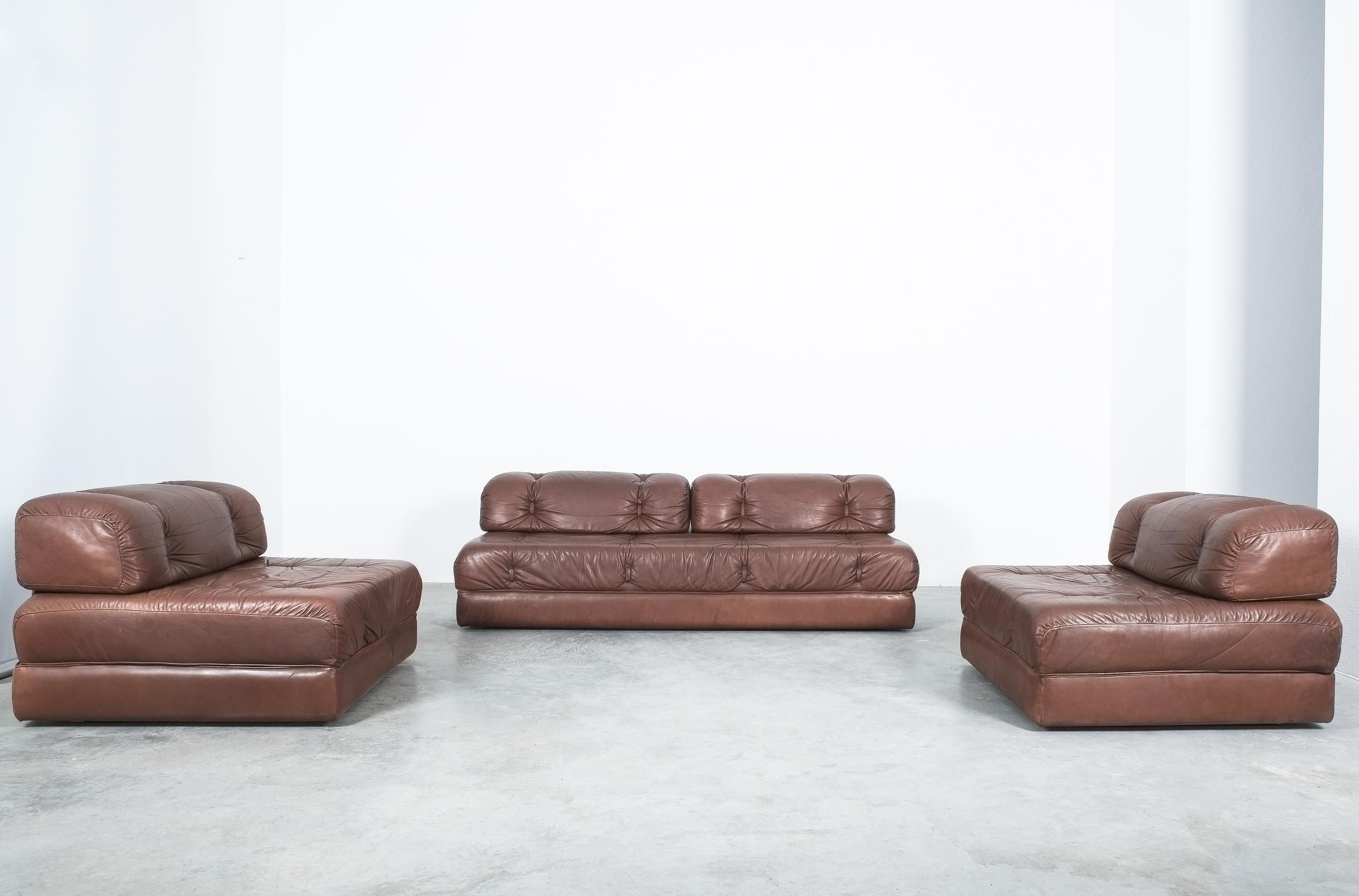 Wittmann Atrium sofa and two chairs brown leather, Austria, circa 1970

Well preserved convertible sofa with 2 matching chairs by Karl Wittmann in original condition. The Atrium was produced in the same era and style as many modular or metabolist