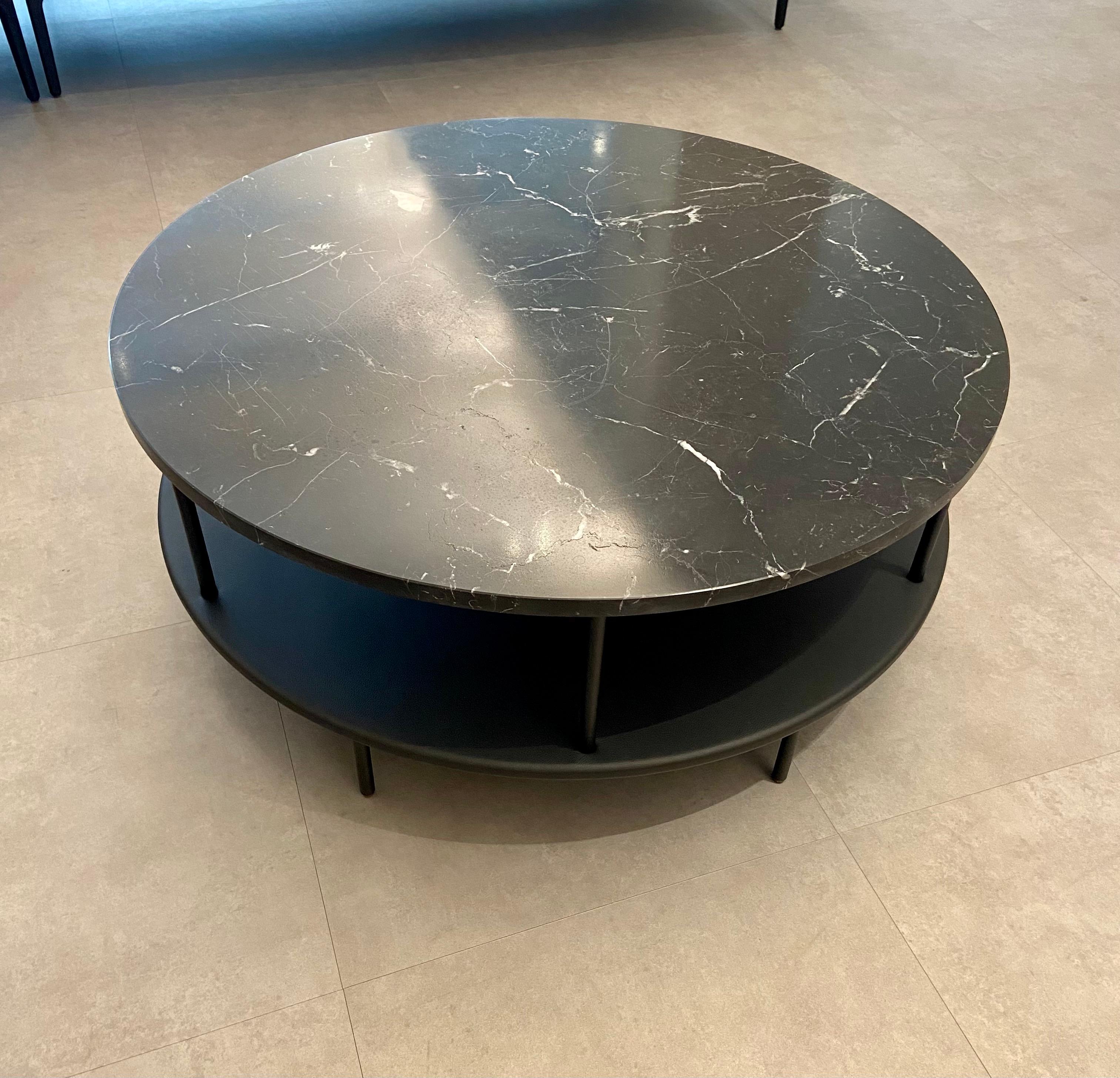 The DD table brings refinement to any furnishings with its playful use of precious materials and the subtle break in the lines. Two table tops, the bottom covered with leather, the top in marble, connected with aluminum rods. They are offset,