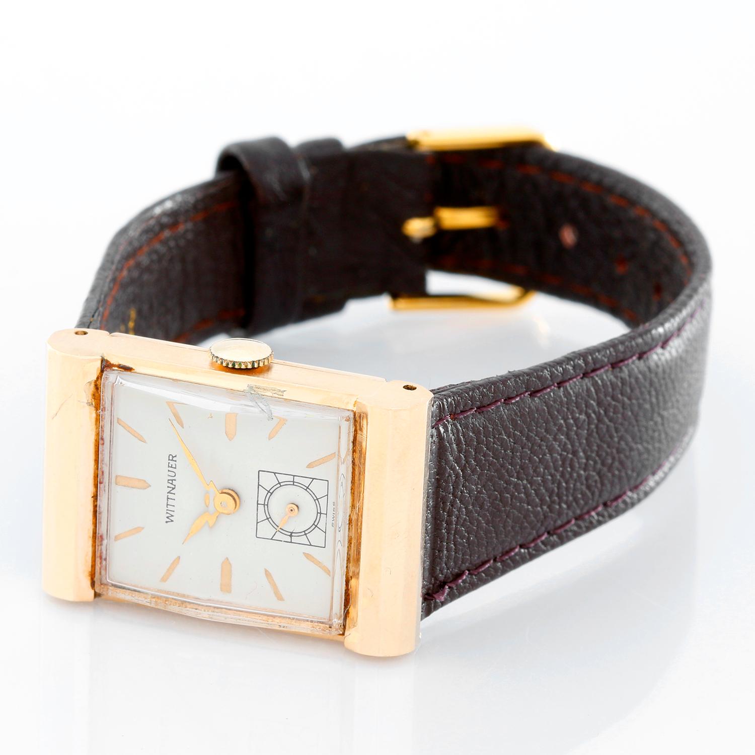 Wittnauer 14K Yellow Gold Vintage Watch - Manual winding. 14K yellow gold ( 22 x 32mm ) . White dial with stick hour markers . Brown leather strap with tang buckle. Pre-owned with custom box .