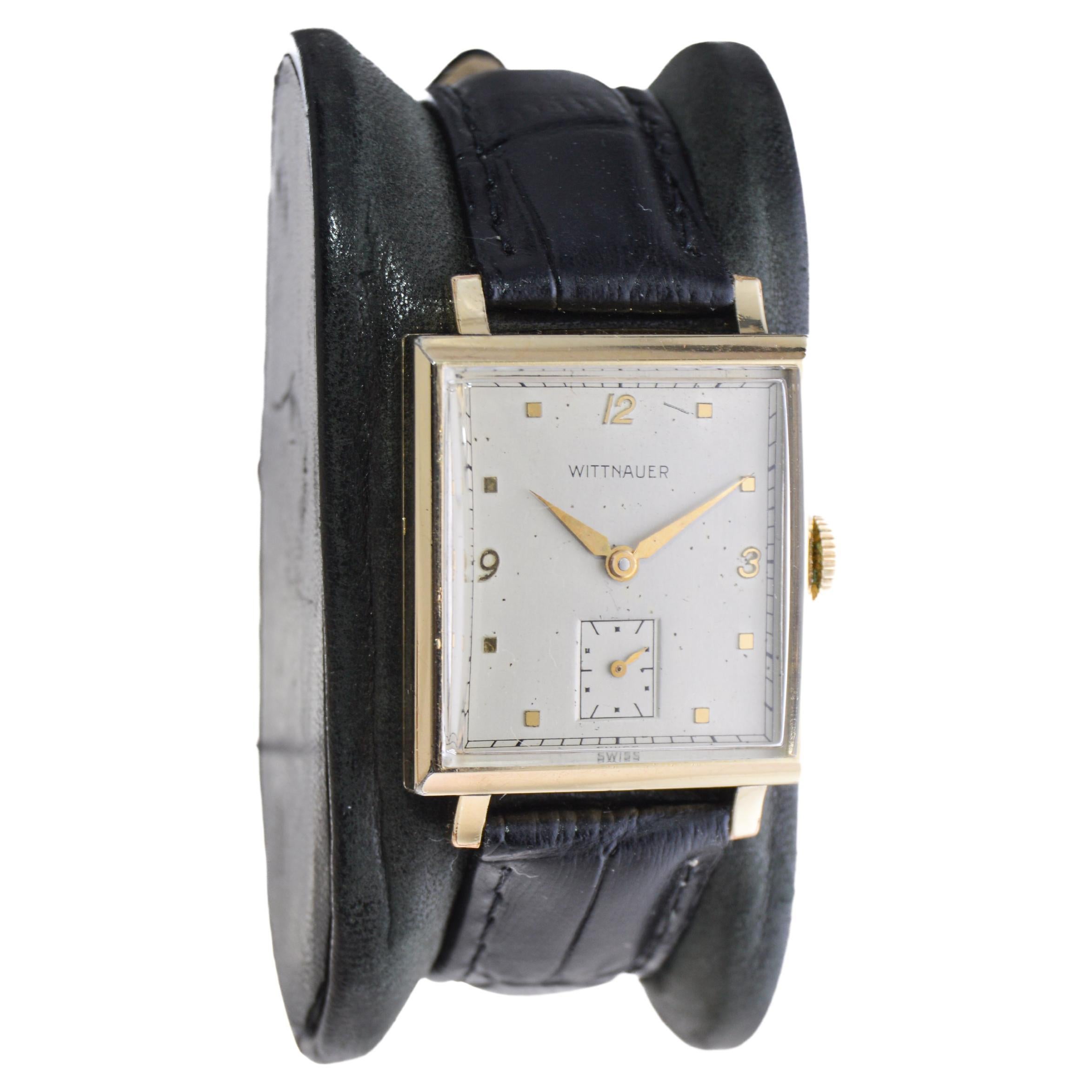 FACTORY / HOUSE: Wittnauer Watch Company
STYLE / REFERENCE: Art Deco
METAL / MATERIAL: Yellow Gold Filled
CIRCA / YEAR: 1940's
DIMENSIONS / SIZE: 36mm Length X 26mm Width
MOVEMENT / CALIBER: Manual Winding / 15 Jewels 
DIAL / HANDS: Silvered with