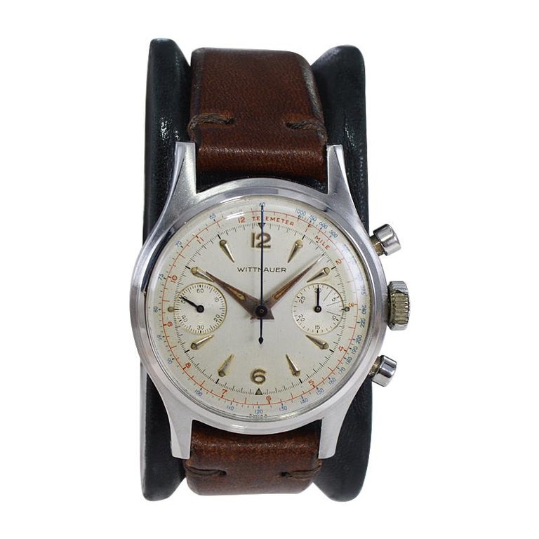 FACTORY / HOUSE: Wittnauer Watch Company
STYLE / REFERENCE: Two Register Chronograph
METAL / MATERIAL: Stainless Steel
CIRCA / YEAR: 1950's
DIMENSIONS / SIZE: Length 44mm X Diameter 35mm
MOVEMENT / CALIBER: Manual Winding / 17 Jewels / Venus