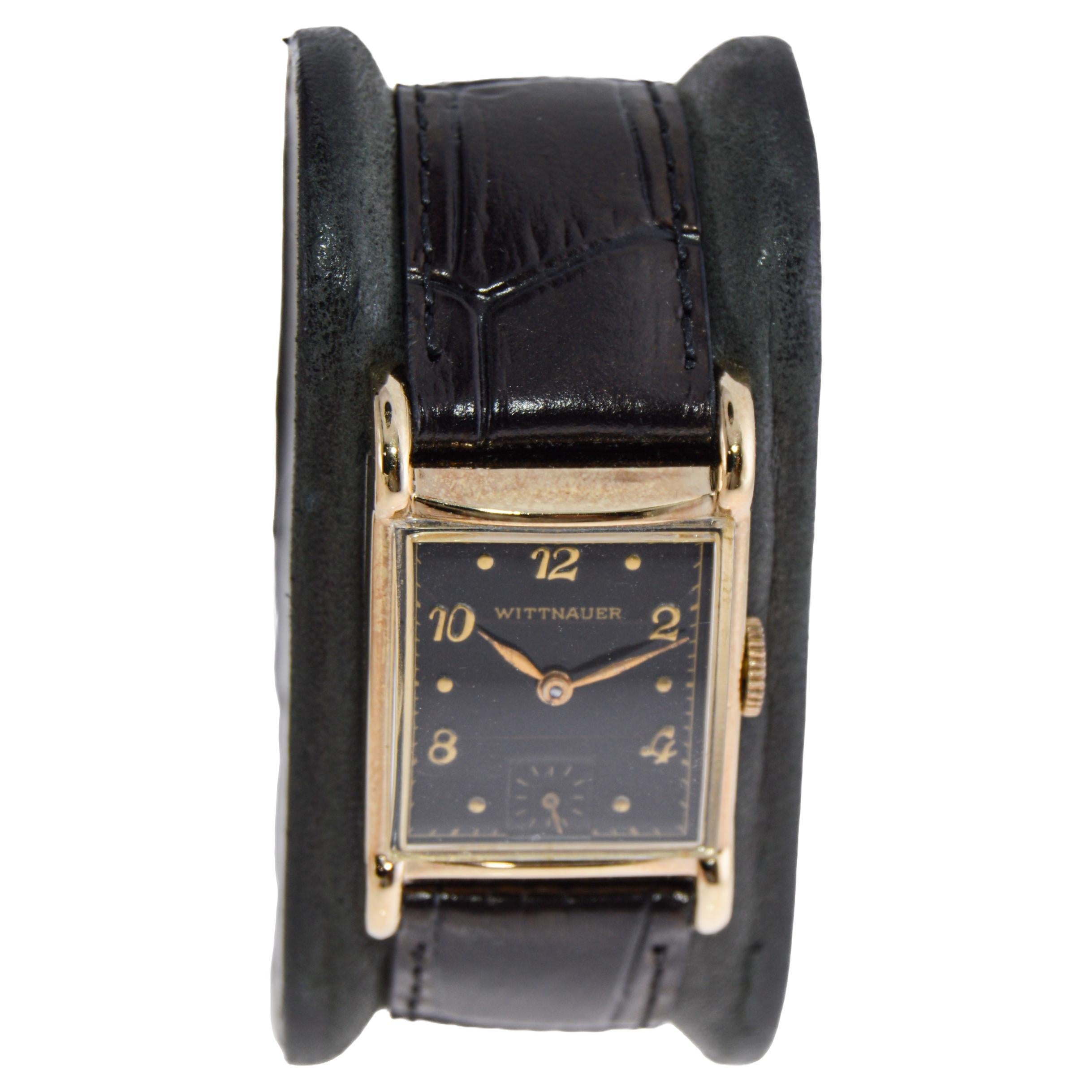 FACTORY / HOUSE: Wittnauer Watch Company
STYLE / REFERENCE: Art Deco / Tank Style
METAL / MATERIAL: Gold Filled 
DIMENSIONS / SIZE: 37mm Length X 27mm Width
MOVEMENT / CALIBER: Manual Winding / 17 Jewels / Caliber 72 Revue
DIAL / HANDS: Black Dial