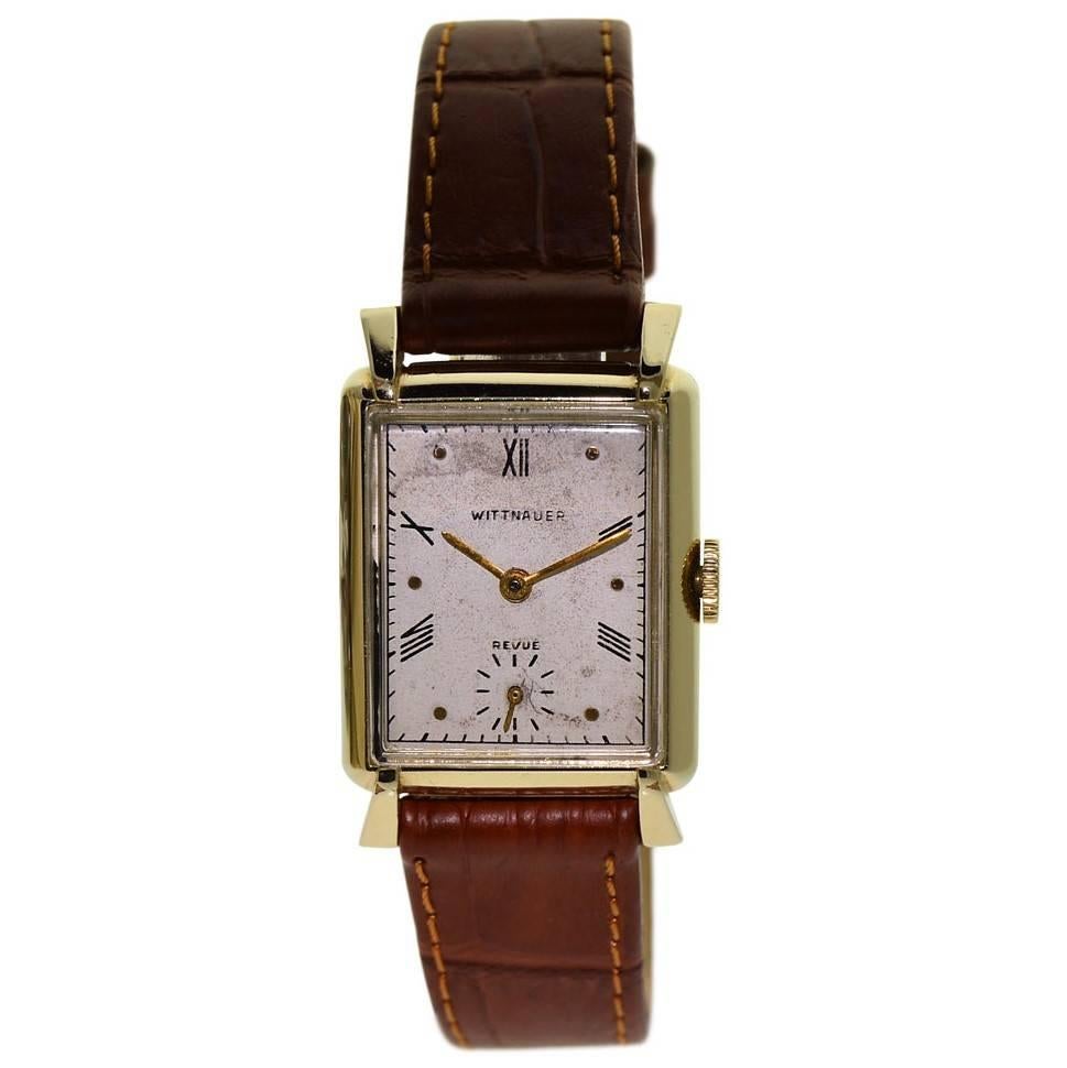 FACTORY / HOUSE: Wittnauer Watch Company
STYLE / REFERENCE: Tank / Art Deco
METAL / MATERIAL: Yellow Gold Filled
CIRCA: 1940's
DIMENSIONS: 36mm X 24mm
MOVEMENT / CALIBER: Manual Winding / 17 Jewels 
DIAL / HANDS: Original Silvered with Roman