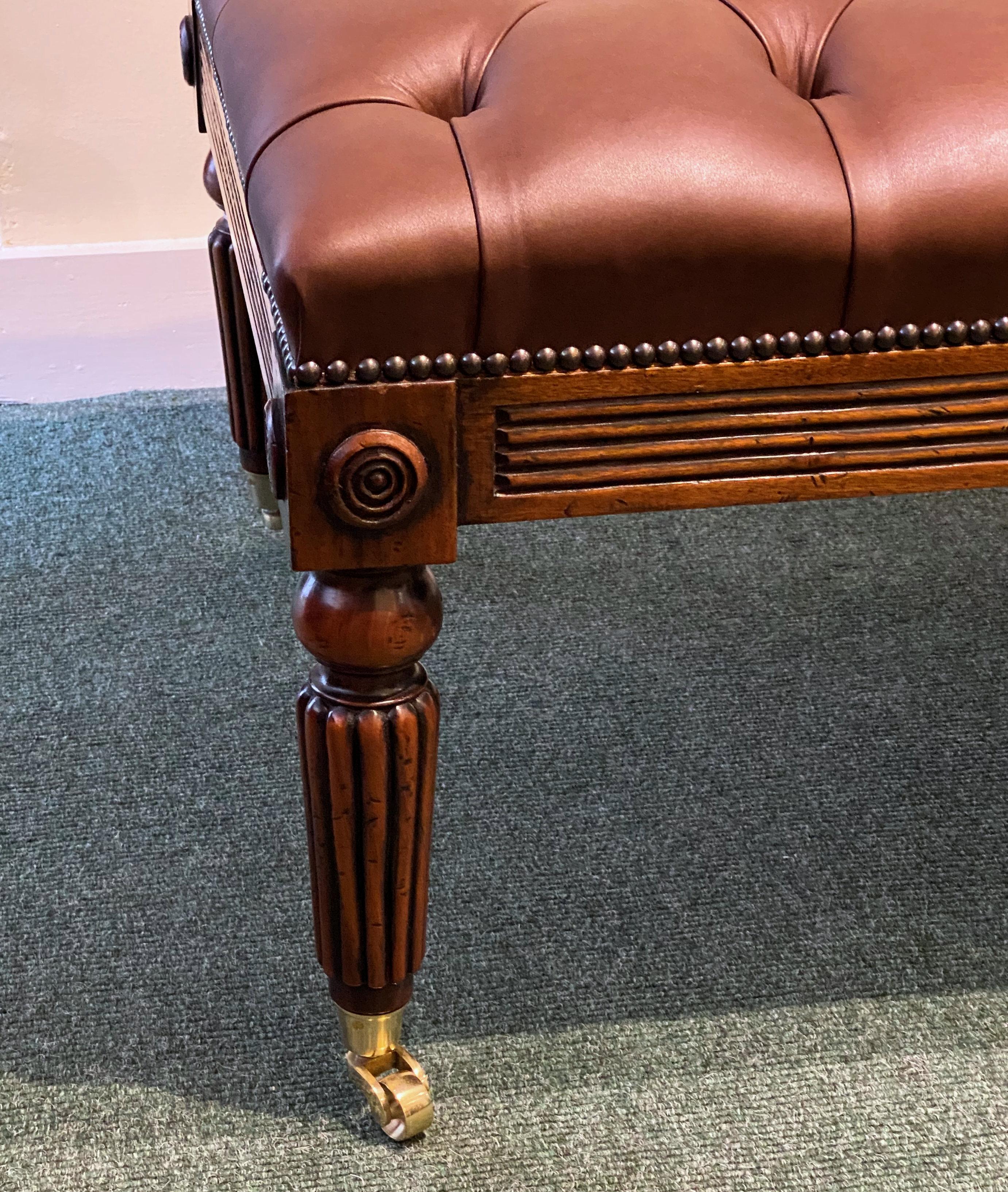 This gorgeous and very functional WIV styled Gillows designed leather stool features deep buttoned cocoa brown upholstery supported on 6 turned reeded legs with solid brass castors. It measures 48 in – 122 cm long, 27 in – 68.5 cm deep and 19 in –