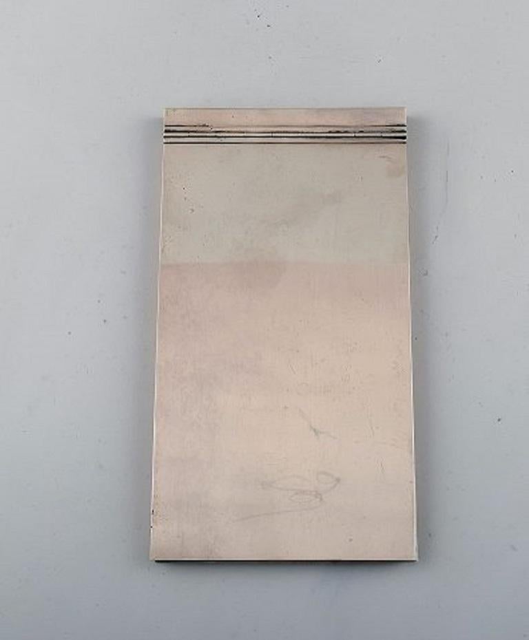 Wiwen Nilsson Lund, Sweden (b. 1897-d. 1974). Rare, modernist notebook in sterling silver. Mid-20th century.
In very good condition.
Measures: 22.5 x 12.5 cm.
Stamped.