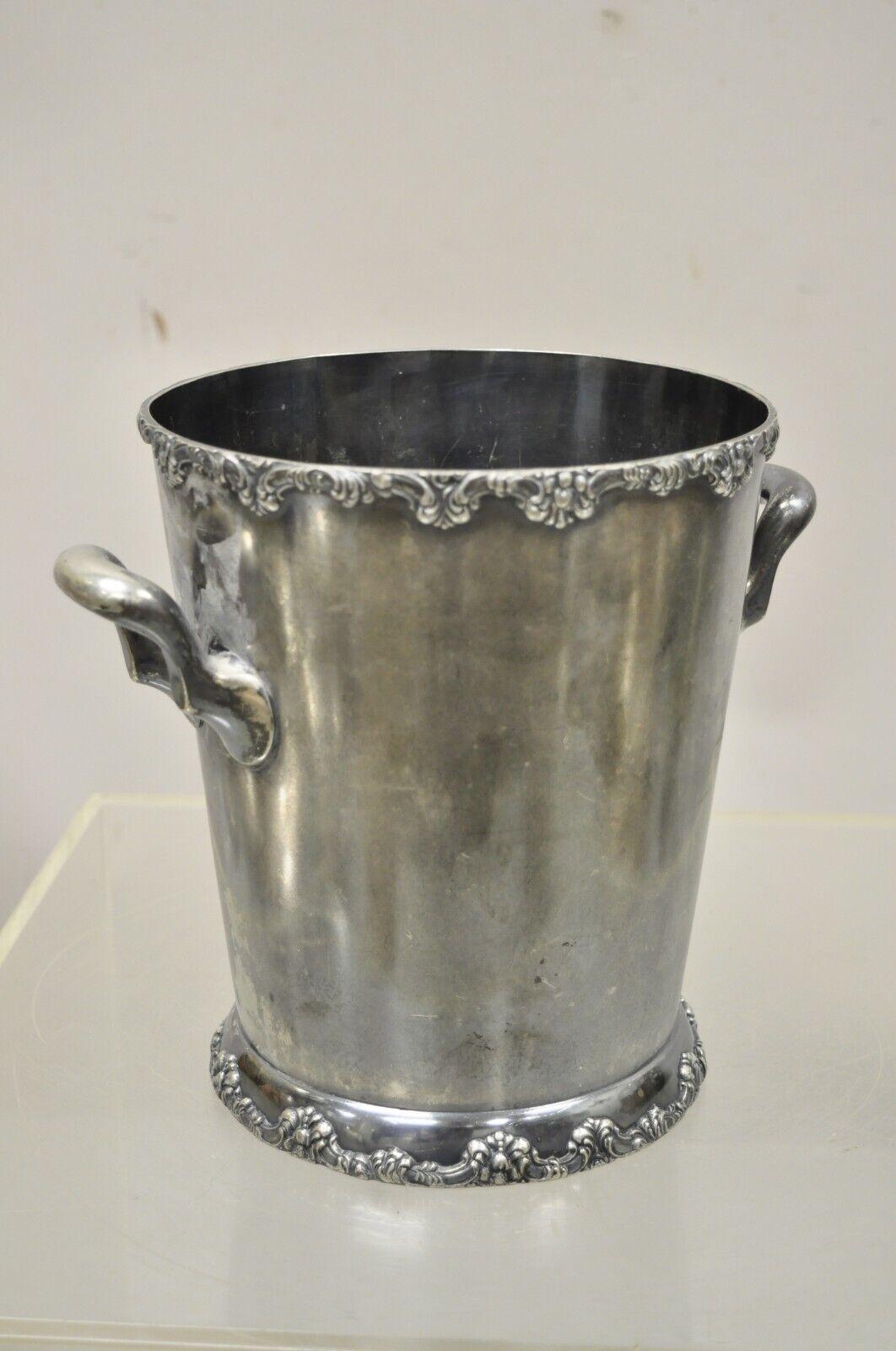 WM A. Rogers Twin Handle Regency style silver plate wine chiller ice bucket. Circa mid 20th century. Measurements: 9