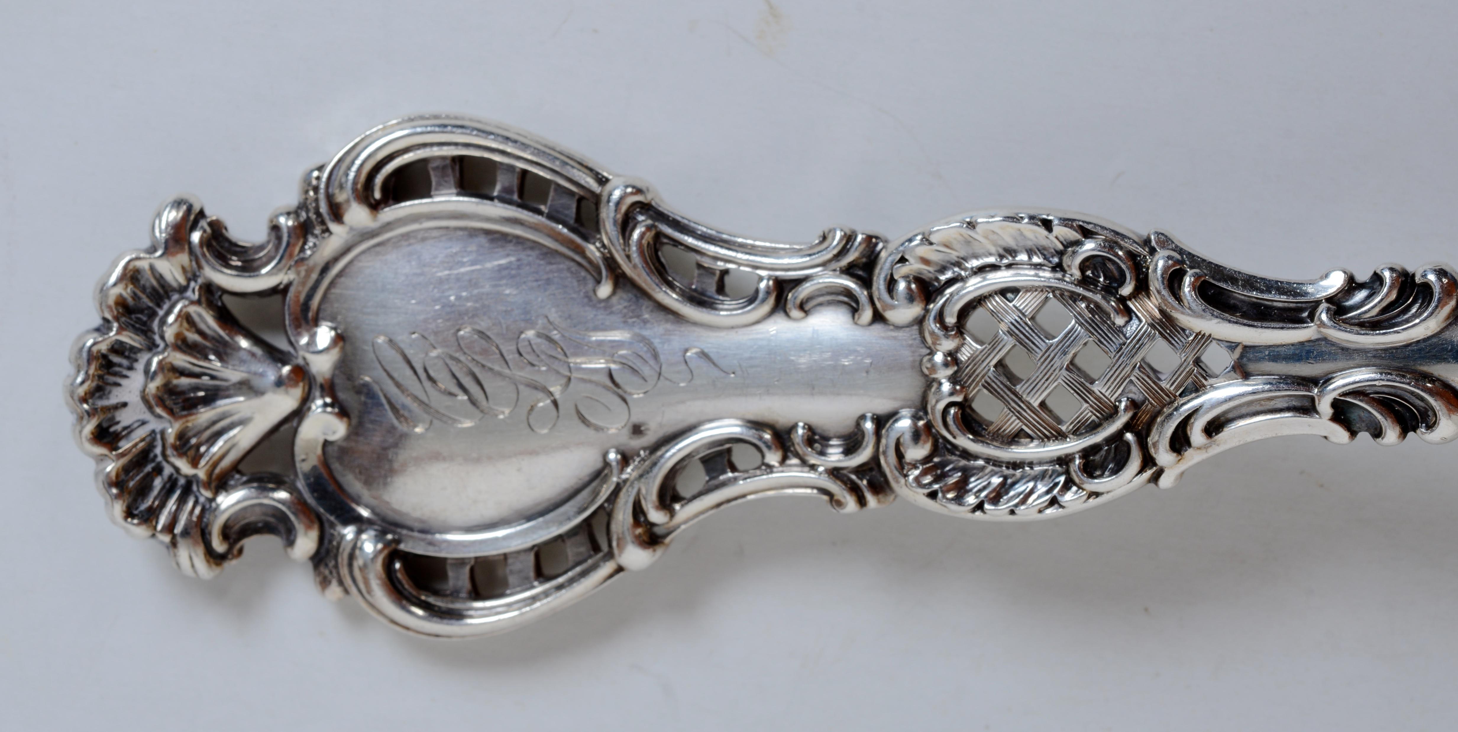 Wm. B. Durgin Co. Regent Pattern Sterling Silver Cold Meat Serving Fork. This pattern is known for its ornate scroll, fan, and trellis motifs on the front and back of the handle. One of Durgin's most desirable and rare patterns.
Trent Antiques has