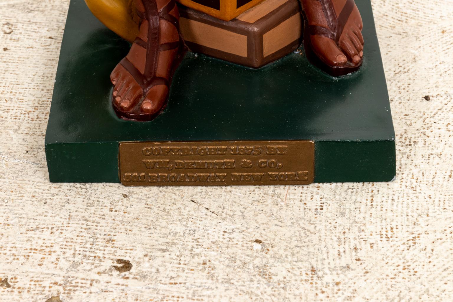 Rare polychrome painted zinc cigar store Native American statue by W.M. Demuth. The piece retains its original label. The label reads 