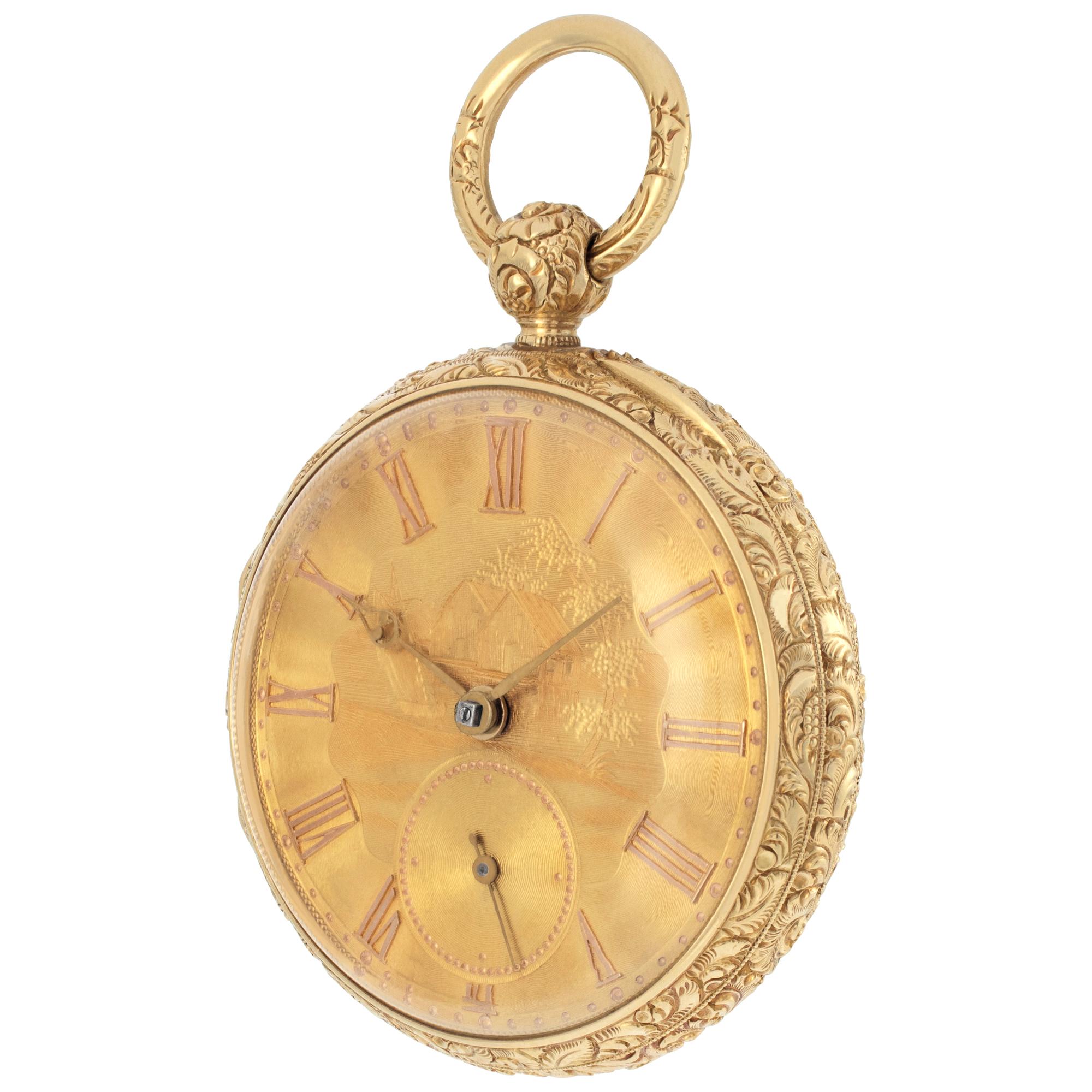 WM Robinson English lever pocket watch in 18k yellow gold. Finely engraved case and gold dial. Key wind. 46mm case size. Circa 1820's. Fine Pre-owned W.M. Robinson Watch. Certified preowned Vintage W.M. Robinson pocket watch watch is made out of