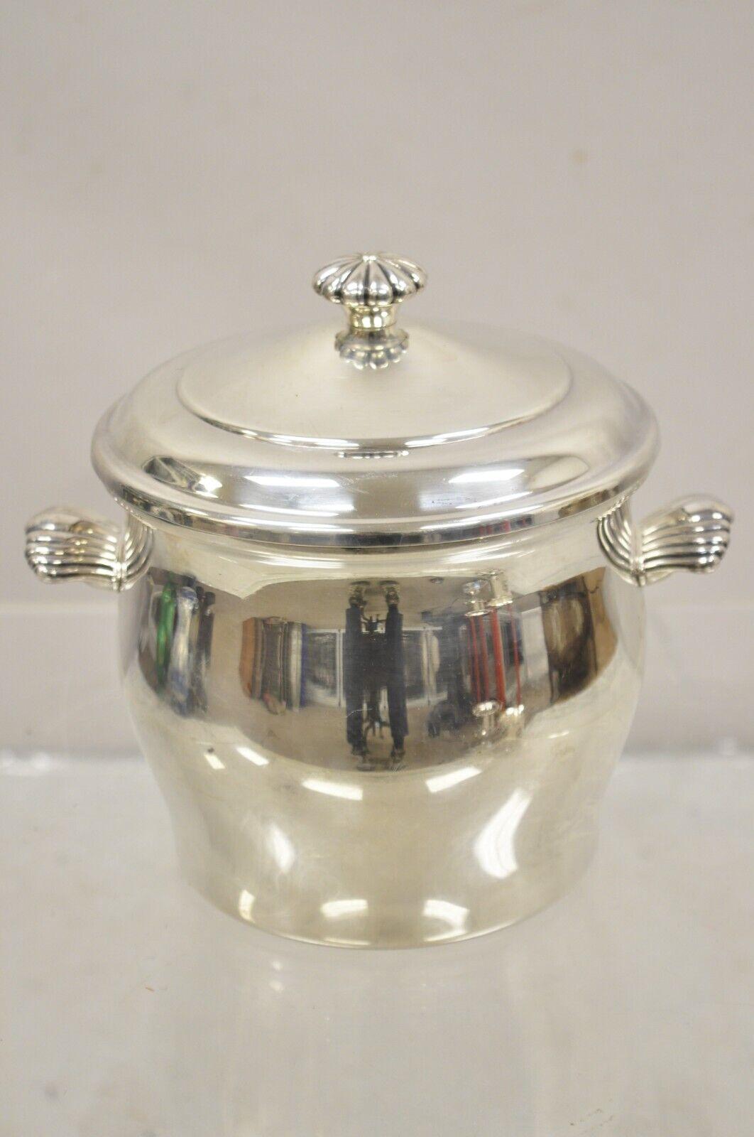 WM Rogers & Son Paul Revere 27 Silver Plated Lidded Ice Bucket. Item features leafy twin handles, glass liner, clean modernist lines, original hallmark. Circa Mid 20th Century. Measurements: 8