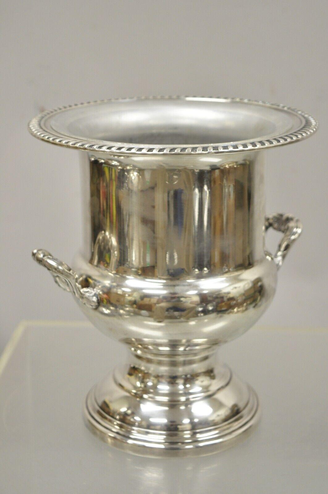 WMA Rogers Vintage Silver Plate Trophy Cup Urn Champagne Bucket Ice Chiller. Item features a removable liner, ornate handles, desirable trophy cup form, original stamp, very nice vintage item. Circa Mid 20th Century. Measurements: 10
