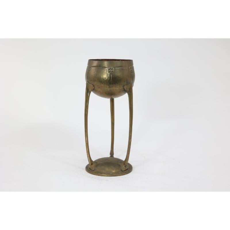 German WMF. A hand beaten brass chalice, the bowl raised on three organic supports. For Sale
