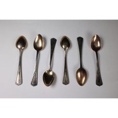 WMF. A set of six Art Nouveau silver plated desert spoons in unused condition.