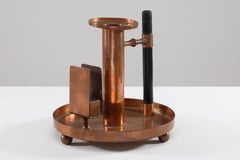 WMF. An Aesthetic Movement Copper Chamber Candlestick in the Dr C Dresser Style