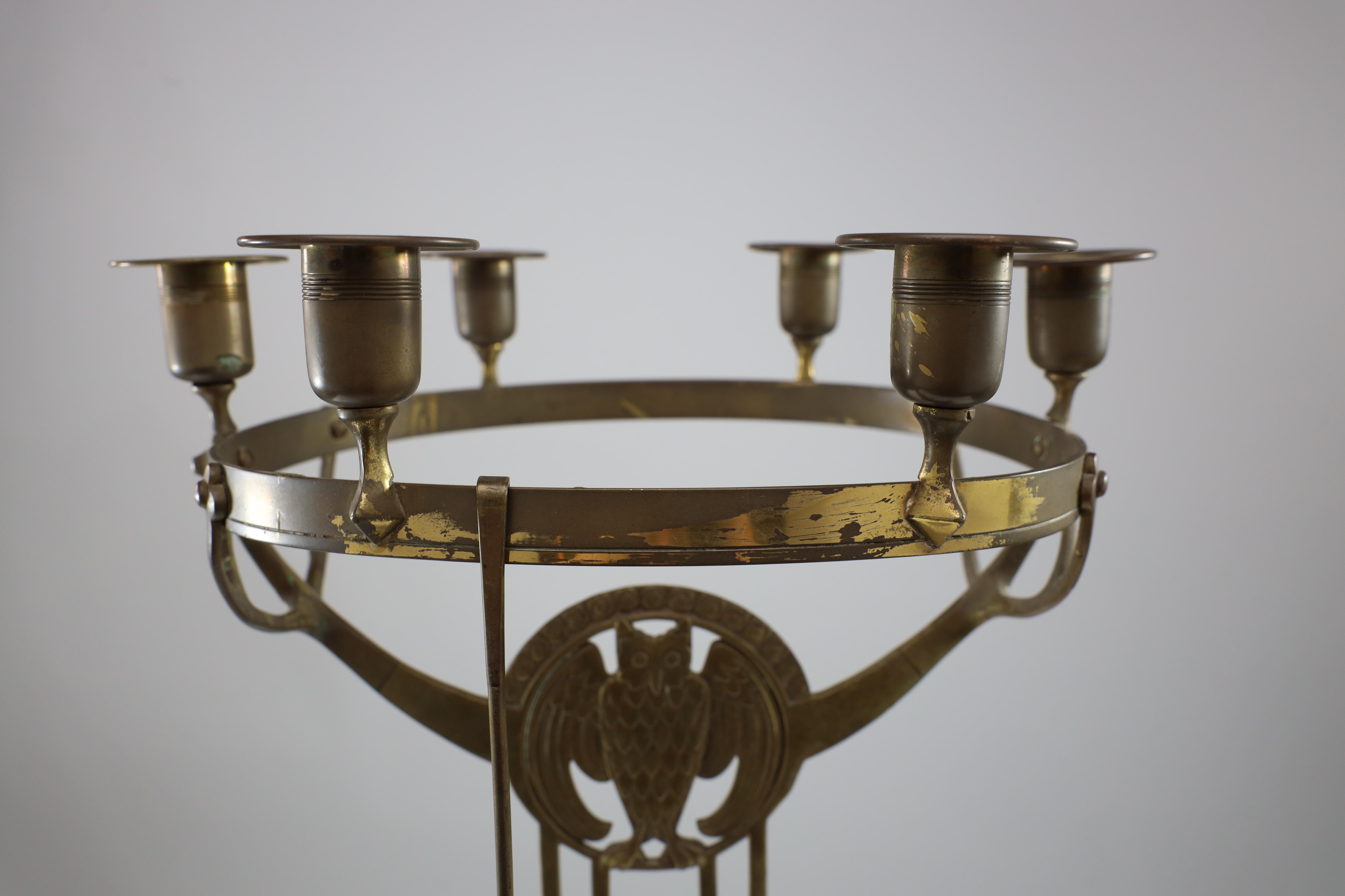 Brass WMF An Art Nouveau candelabra with an owl & 6 sconces to the main circular ring. For Sale