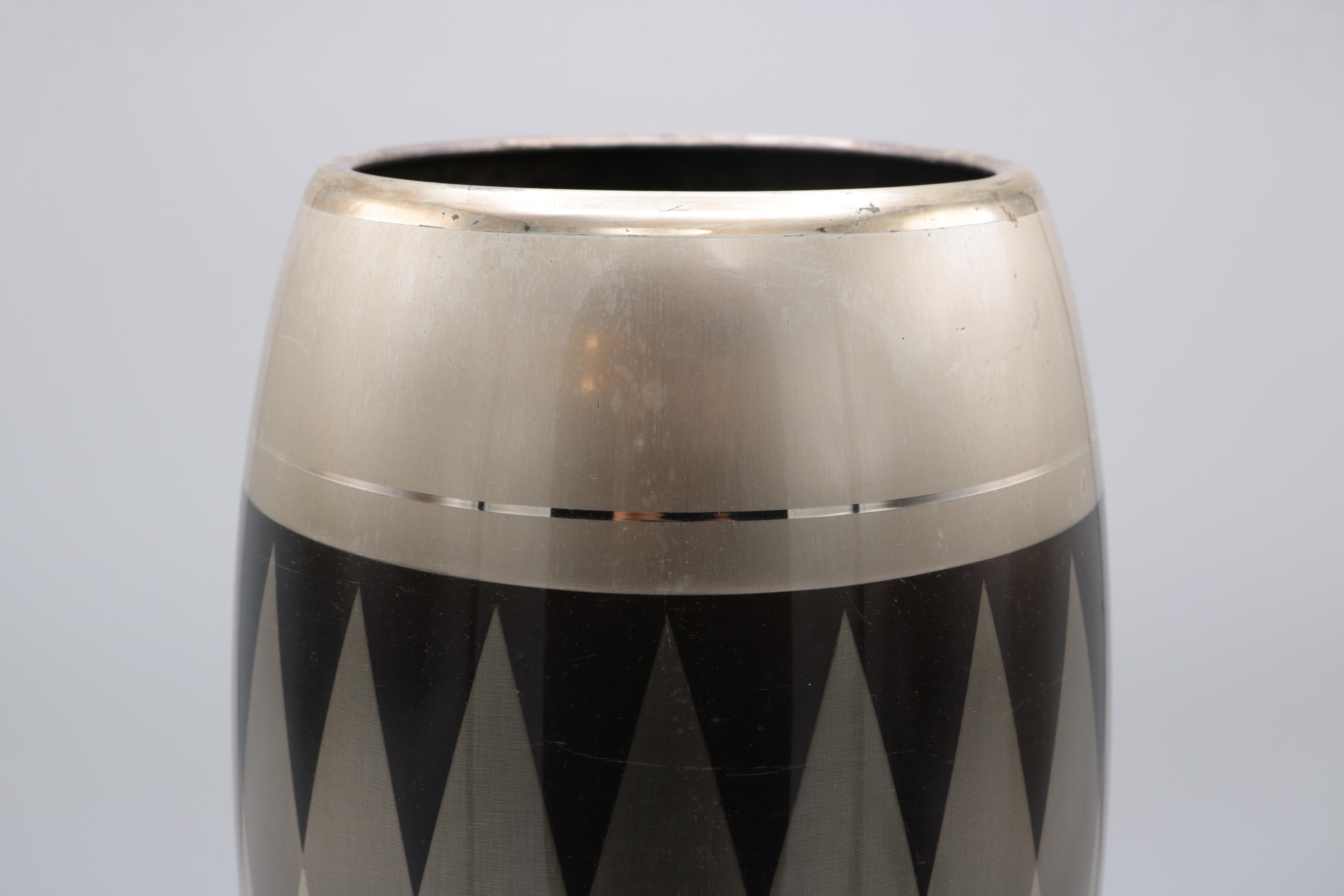 A WMF Art Deco mixed metal vase with geometric diamond patterns. 
Signed underneath : WMF.