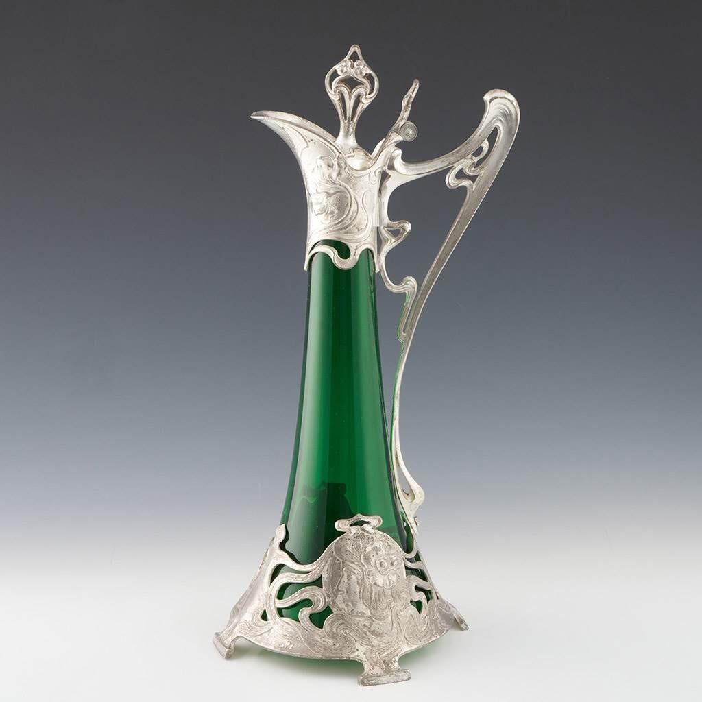Heading : Albert Mayer for WMF silver plated Art Nouveau green glass claret jug.
Date : c1900
Origin : Gieslingen-an-der-Steige. Germany 
Colour : Green glass. silver plated
Stopper : Pierced
Neck : Tapered
Glass Type : Lead free
Size :   41 cm to
