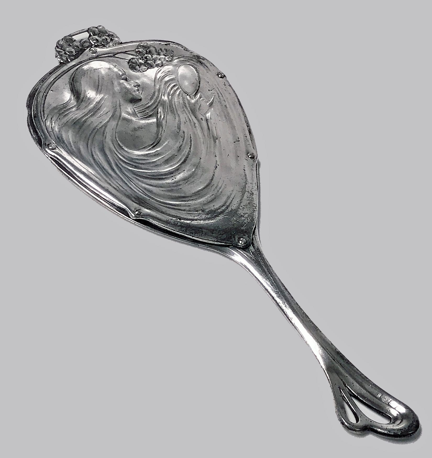WMF Art Nouveau Jugendstil Silver Plate Hand Mirror, Germany C.1906. Wonderful Maiden flowing hair design to reverse, stylised foliate tendril surround to border of front mirror. Full WMF marks. Ref: Page 291 No 31 WMF 1906 Catalogue. Measures: 12 x