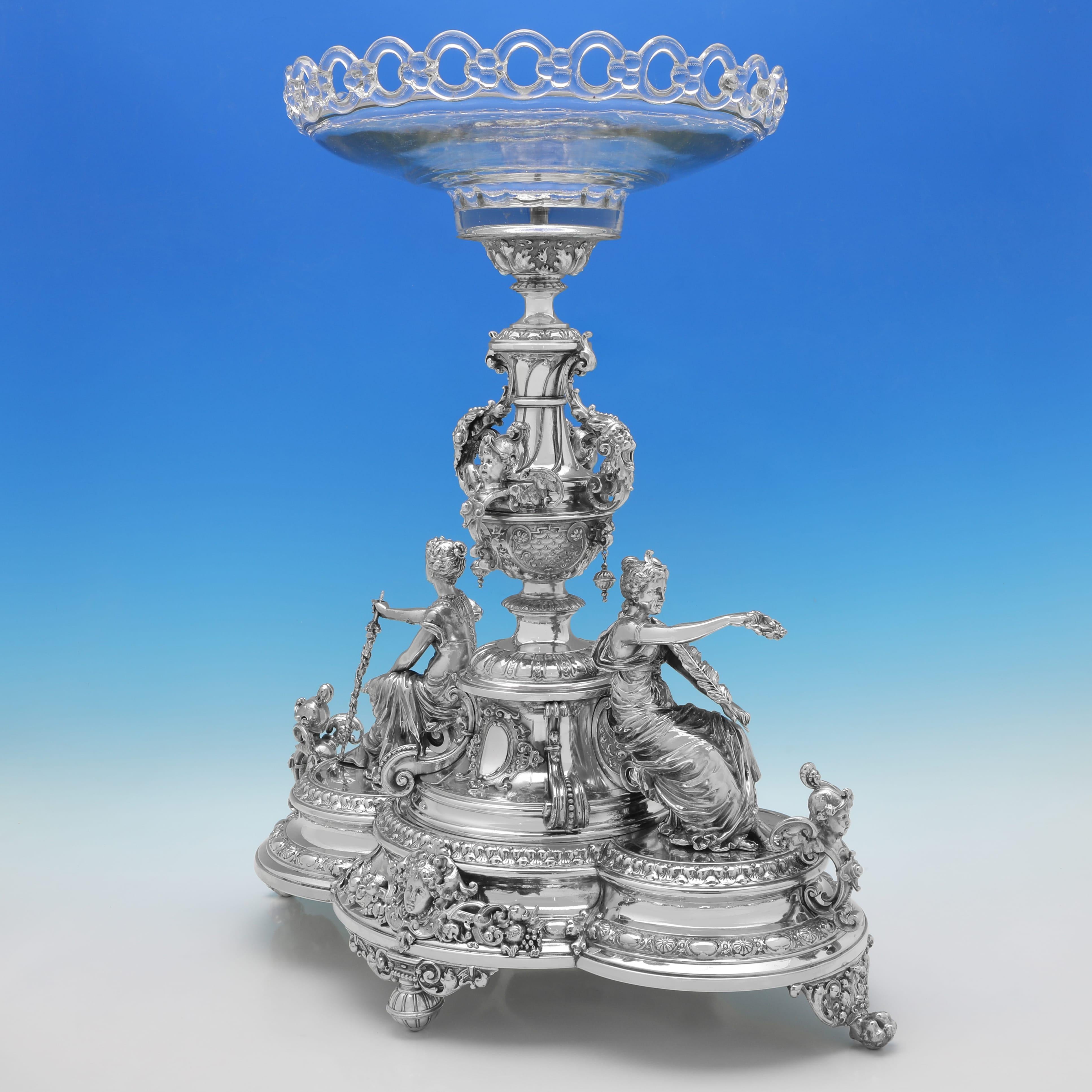 Made circa 1910 by Württembergische Metallwarenfabrik (WMF) in Geislingen an der Steige in Germany, this stunning, Antique Silver Plate Centrepiece, stands on a decorative trefoil base, and features cast seated maidens to each side, and central